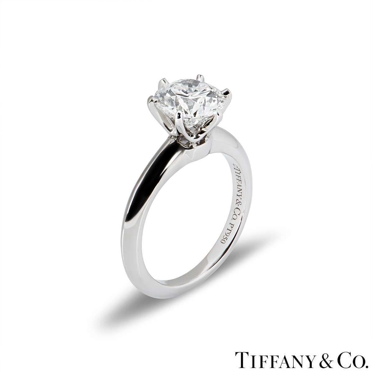 A beautiful platinum diamond ring by Tiffany & Co. from The Setting collection. The ring comprises of a round brilliant cut diamond in a 6 claw setting with a weight of 1.72ct, G colour and VVS2 clarity. The diamond scores an excellent rating in all