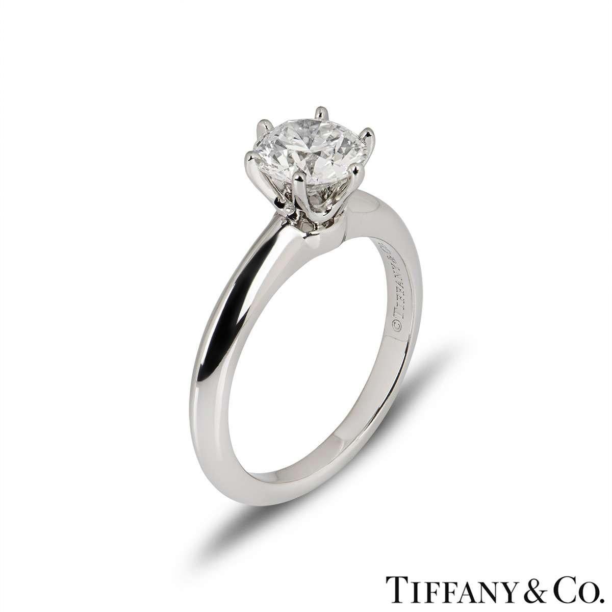 An elegant platinum diamond ring from The Setting collection by Tiffany & Co. The ring comprises of a round brilliant cut diamond in a 6 claw setting with a weight of 1.31ct, H colour and VS1 clarity. The ring is a size UK L½ - EU 51 - US 6 but can