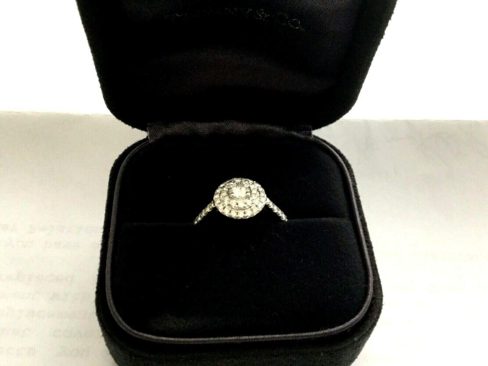 Being offered for your consideration is a like new Tiffany & Co Platinum and Diamond .43 total carat SOLESTE ring  in the classic HALO pave diamond band..  This ring was given as a Christmas gift in 2018 and hardly worn and can pass for a BRAND NEW