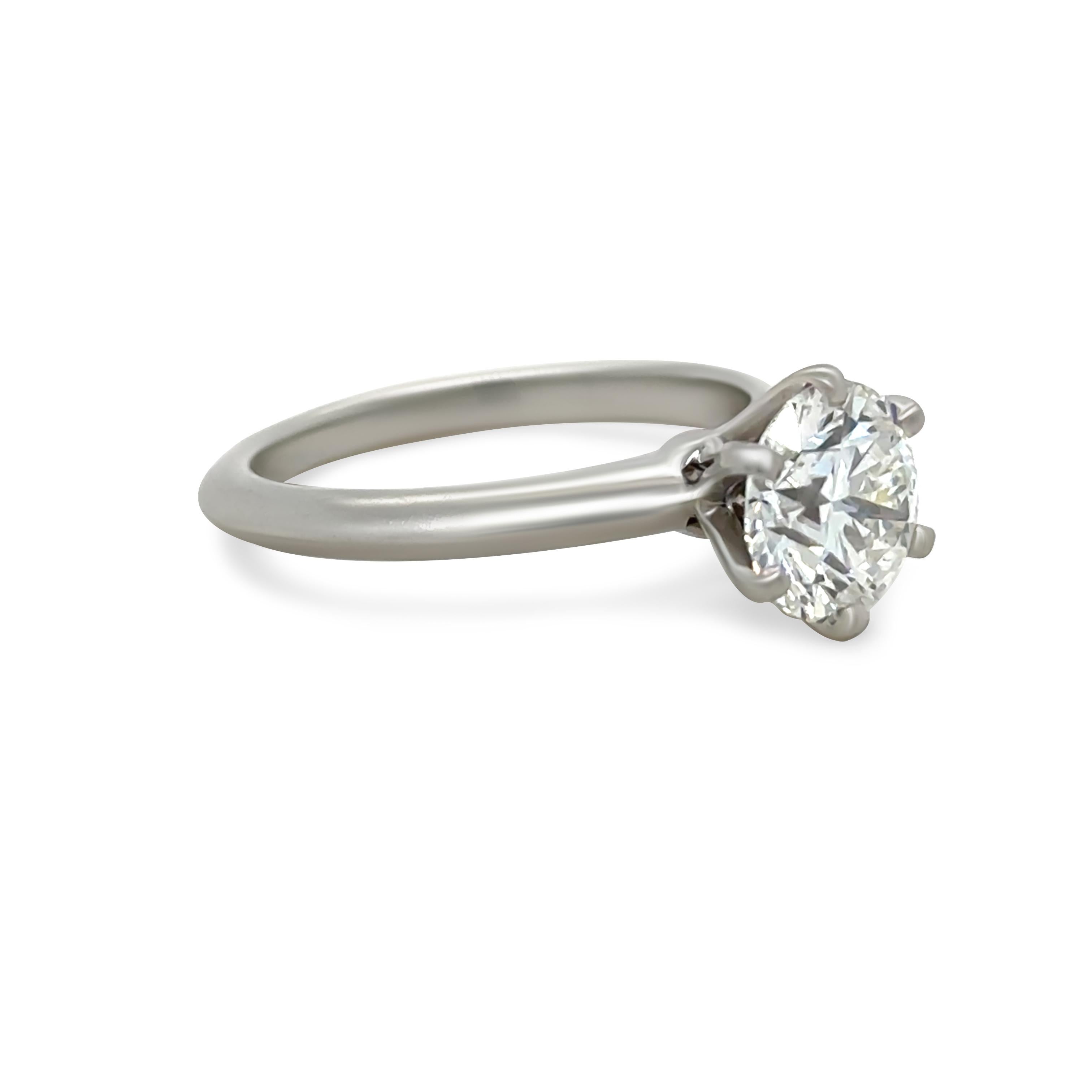 This exquisite Tiffany & Co. diamond solitaire engagement ring is crafted in platinum (PT950) and features a breathtaking 1.66ct round brilliant-cut diamond. The diamond is graded H colour and VS1 clarity, offering exceptional brilliance and