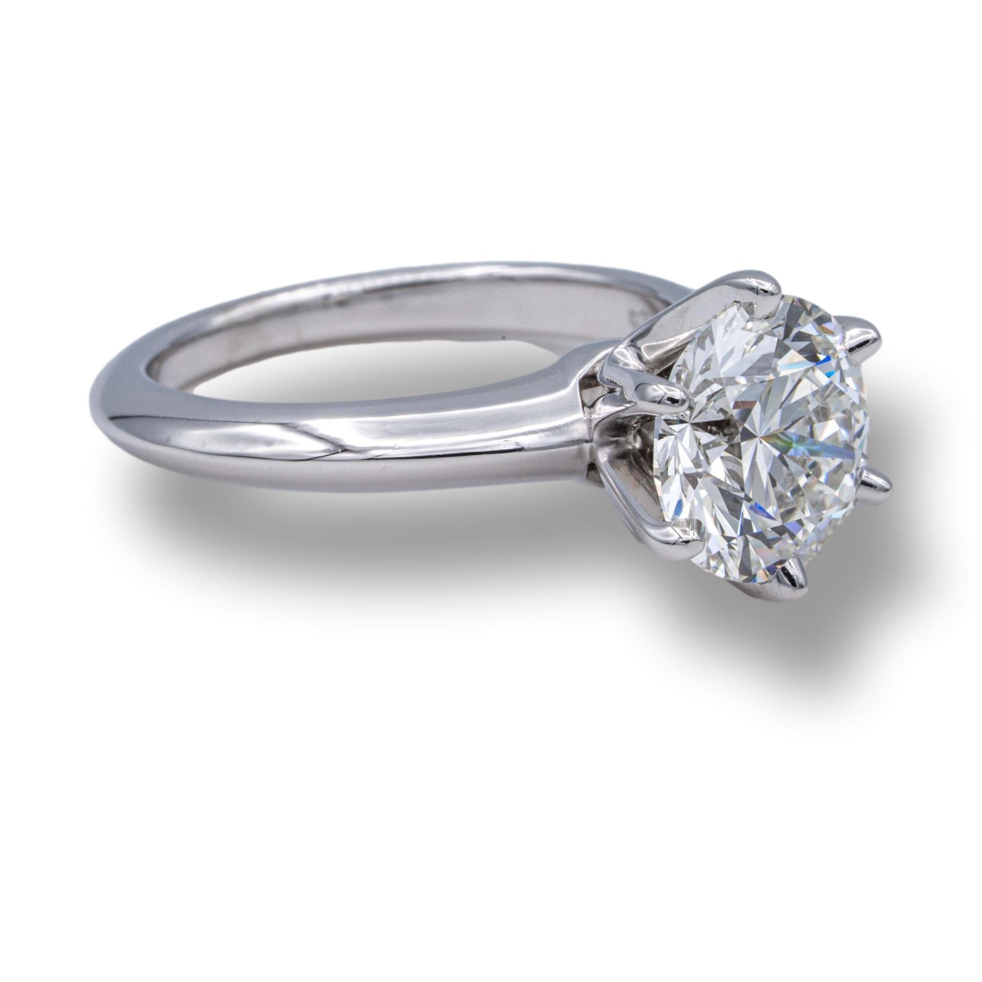 Tiffany & Co Platinum Solitaire Engagement Ring finely crafted in a six prong platinum mounting with one Round brilliant cut diamond center weighing 2.25 cts H color VS1 clarity. Diamond is extremely bright and brilliant. Tiffany's diamond