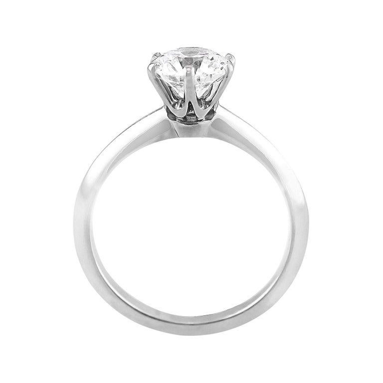 The classic Tiffany Setting ring, a lovely diamond and platinum solitaire. Tiffany & Co. is renowned for their elegantly designed solitaire ring setting, and this is no exception. The round brilliant cut diamond weighs 1.01cts and is GIA-certified