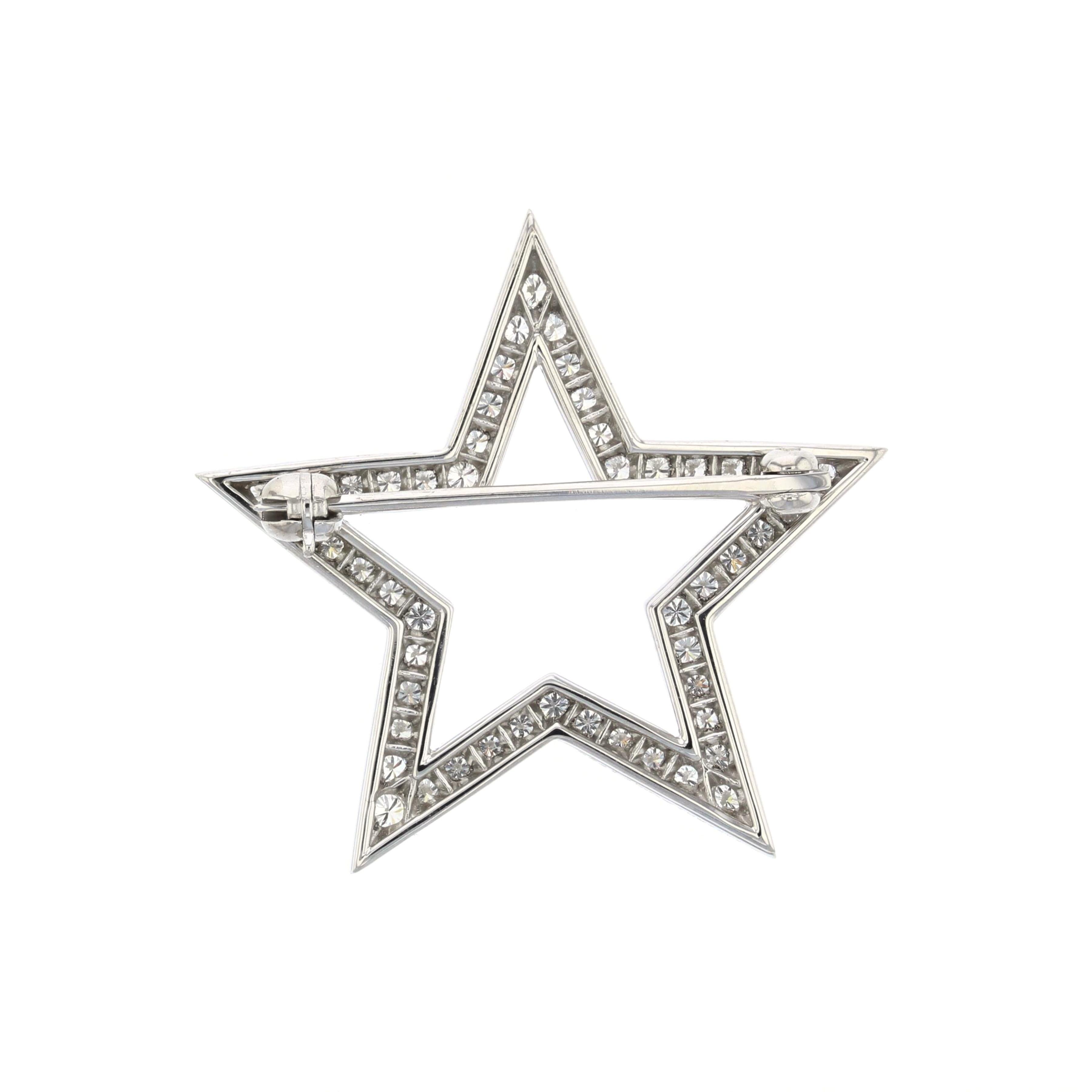 Tiffany & Co. platinum brooch with round diamonds in the shape of an open star.  Features fifty round diamonds totaling 0.85 carats, F-G color and VVS2-VS1 clarity.  Measures 1 1/8 inches across.  