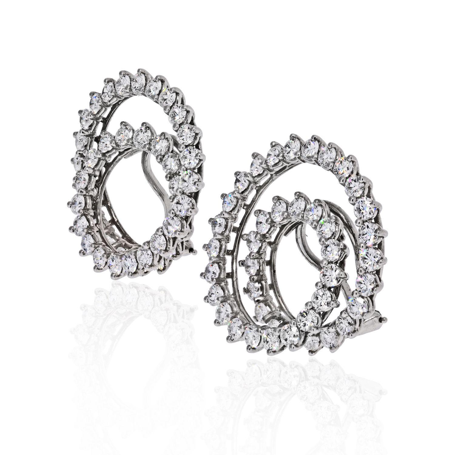 These sparkling Tiffany clip-on earrings feature an iconic swirl design crafted in platinum and set with 82 brilliant-cut round diamonds of an estimated 6.0 carats. Clip-on closure. 20mm wide.
