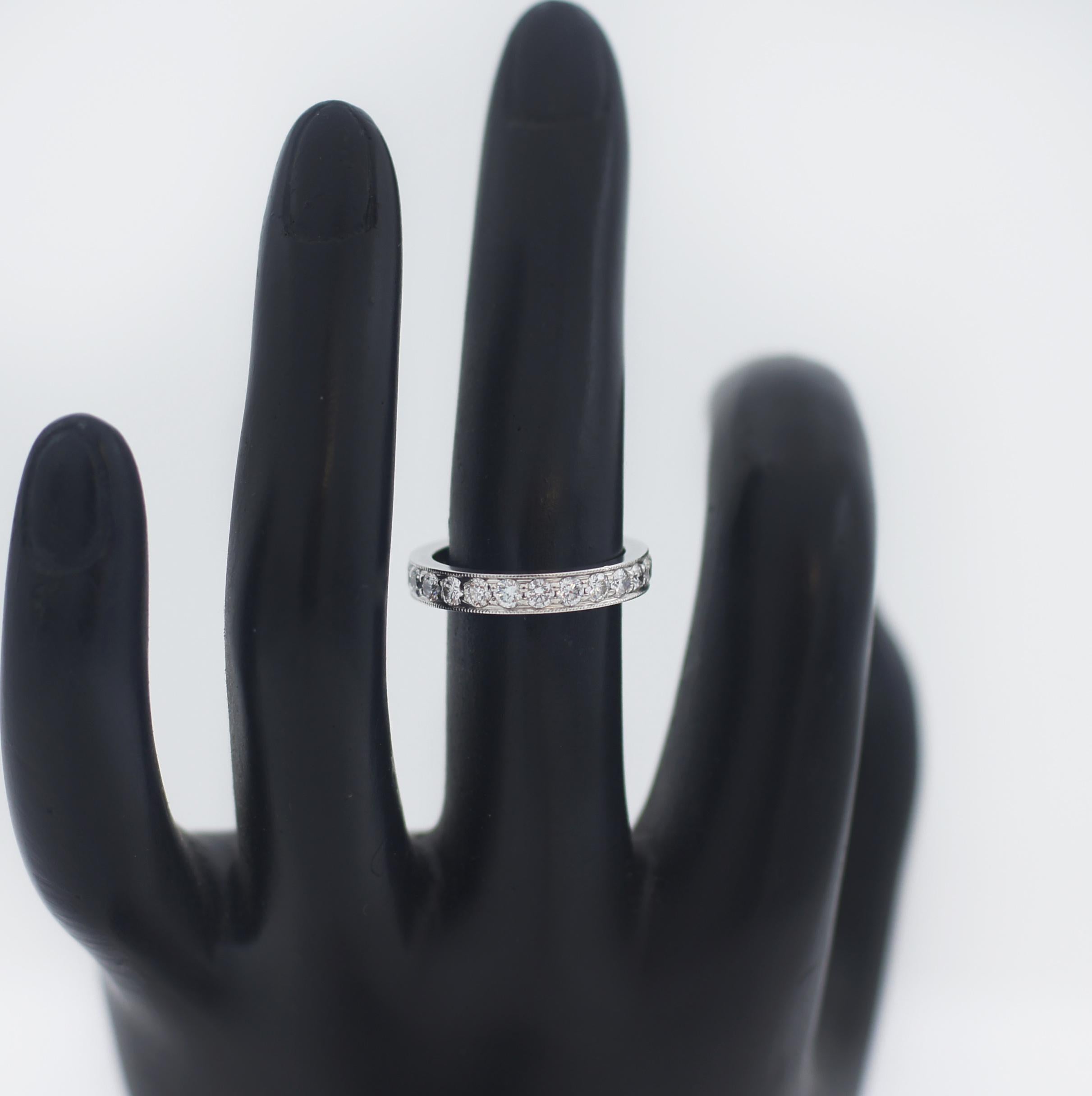 The Tiffany Together collection represents how our most important commitments are uniquely ours and only we can define them. Textured milgrain edges in platinum with diamonds give this ring a modern feel. Pair it with other styles for a bold