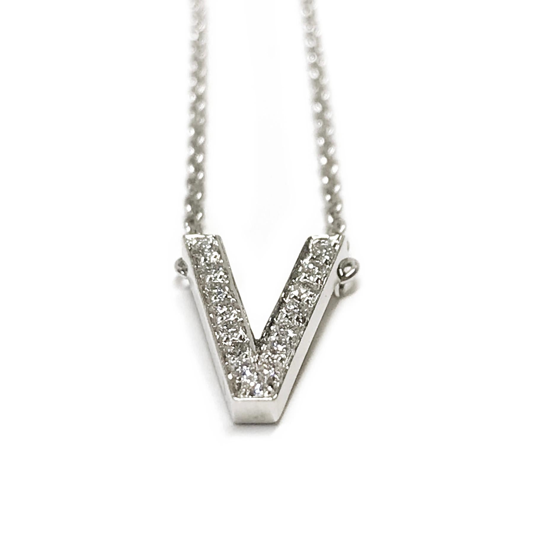 Tiffany & Co. Platinum Diamond V Pendant Necklace with fifteen round brilliant-cut diamonds. The diamonds are pave-set in a V shape. Diamonds are VS in clarity (G.I.A.) and G in color (G.I.A.) and 0.18 total carat weight. The hallmark stamp on the