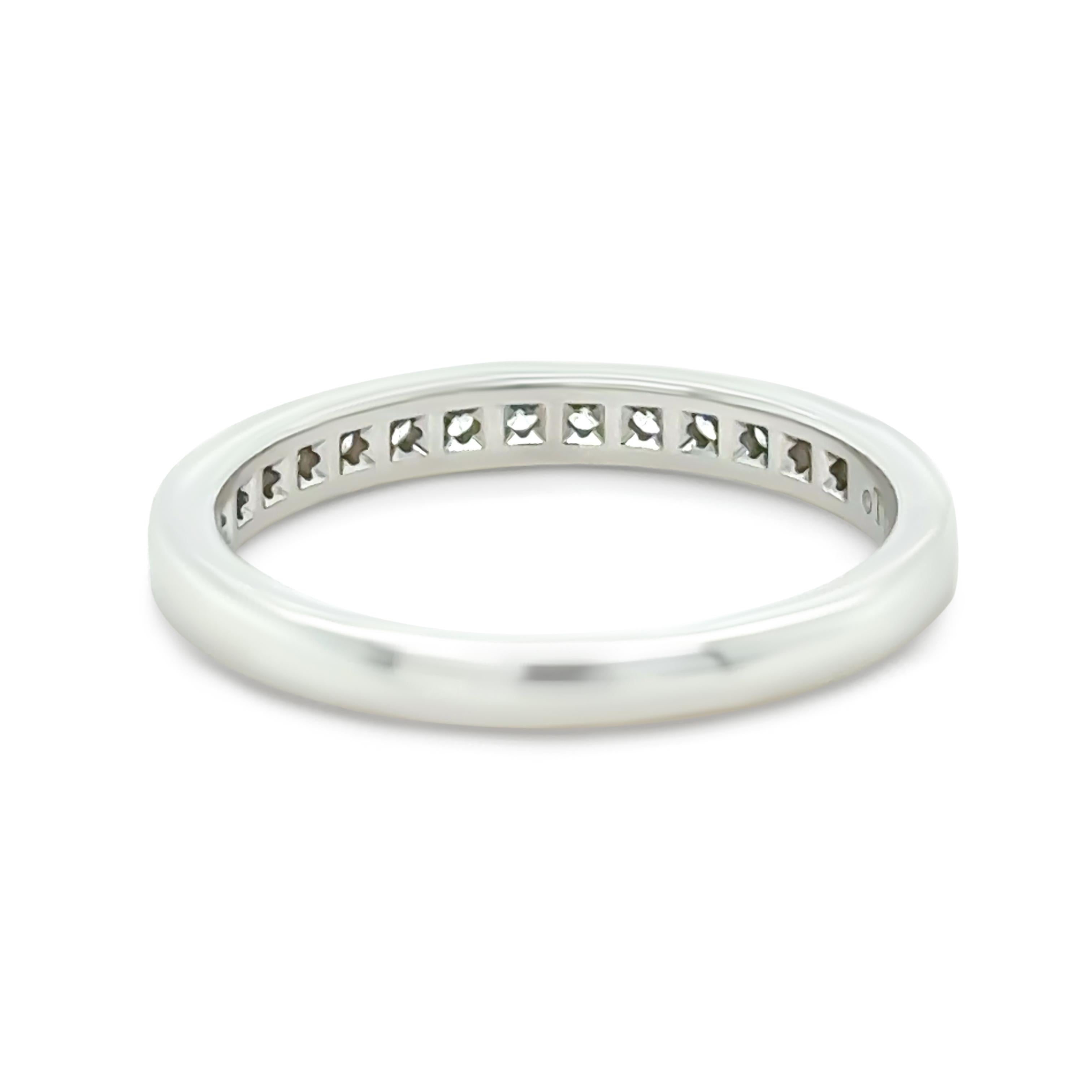 This elegant Tiffany & Co. platinum ring (PT950) features a total of 15 round brilliant-cut diamonds, set in a refined single-channel design. Each diamond measures approximately 1.60mm in diameter, with an individual weight of 0.015ct, combining for