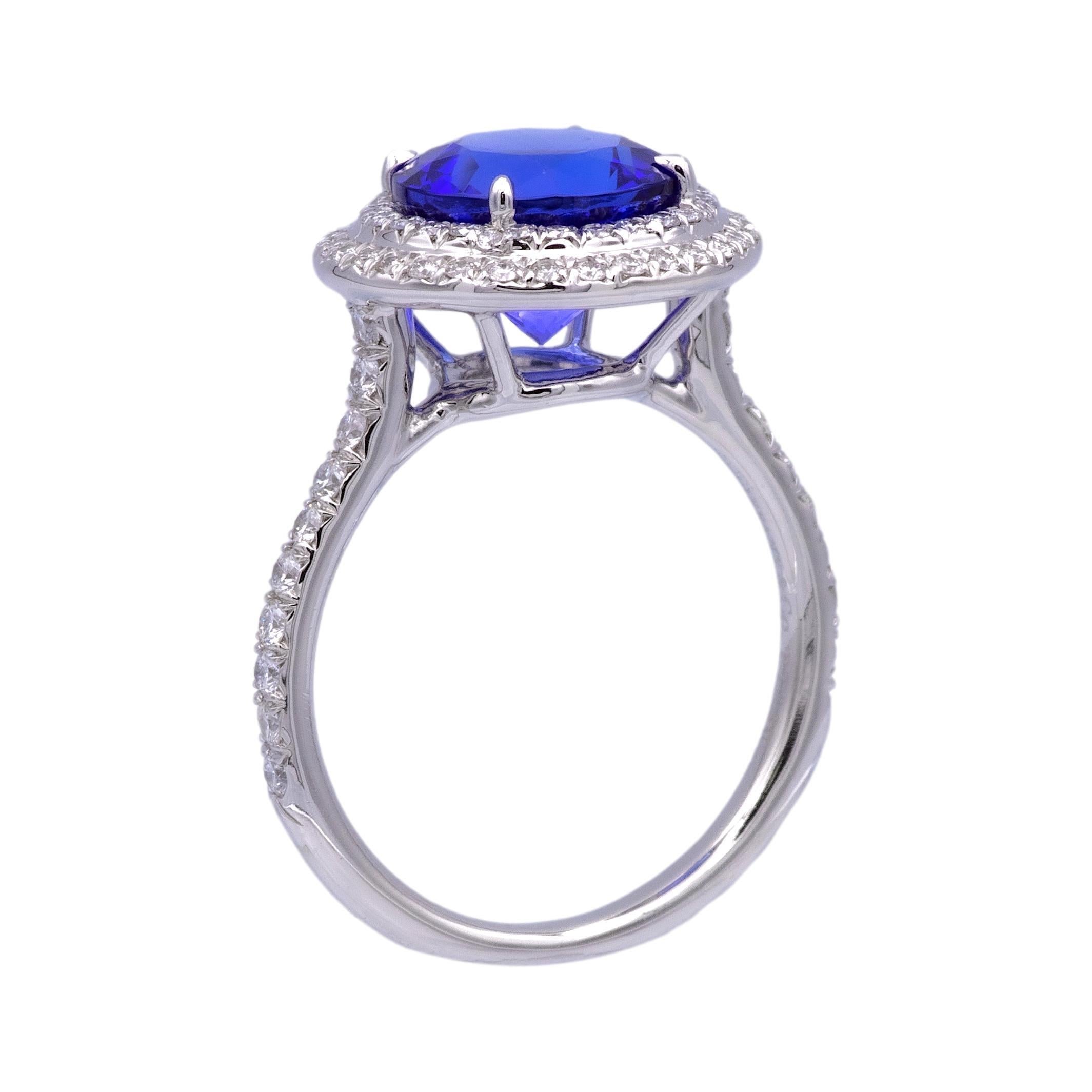 Tiffany & Co. Double Soleste diamond cocktail ring, a masterpiece of elegance and sophistication. Meticulously crafted in platinum, this exquisite piece showcases a mesmerizing violet blue tanzanite round-shaped center, weighing 3.15 carats