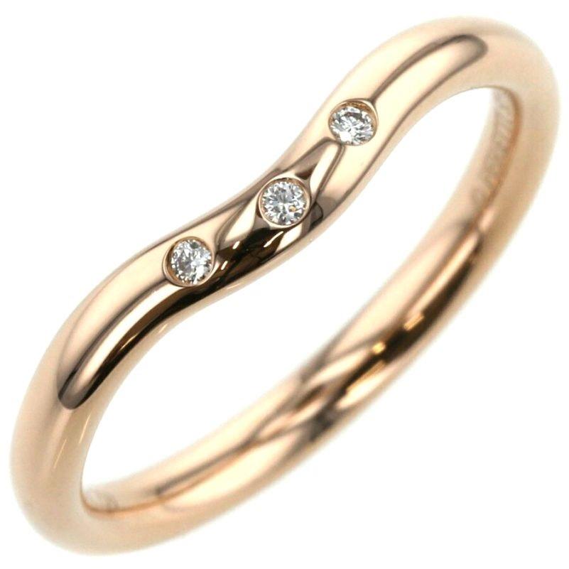 TIFFANY & Co. 18K Rose Gold Elsa Peretti 3 Diamond 2mm Curved Wedding Band Ring 4.5

Metal: 18K rose gold 
Size: 4.5
Weight: 2.60 grams
Width: 2mm
Diamond: 3 round brilliant diamond, carat total weight .03 
Hallmark: TIFFANY&Co. 750 ©PERETTI SPAIN