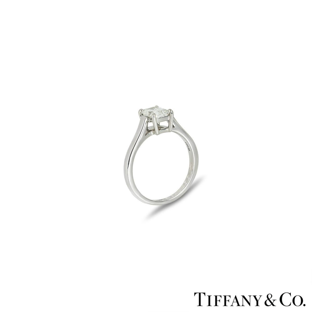 A stunning platinum diamond engagement ring by Tiffany & Co. The solitaire features an emerald cut diamond set to the centre in a 4 prong mount weighing 1.02ct, I colour and VVS2 clarity. The 2mm wide ring is a UK size M/ US size M/ EU size 52 and