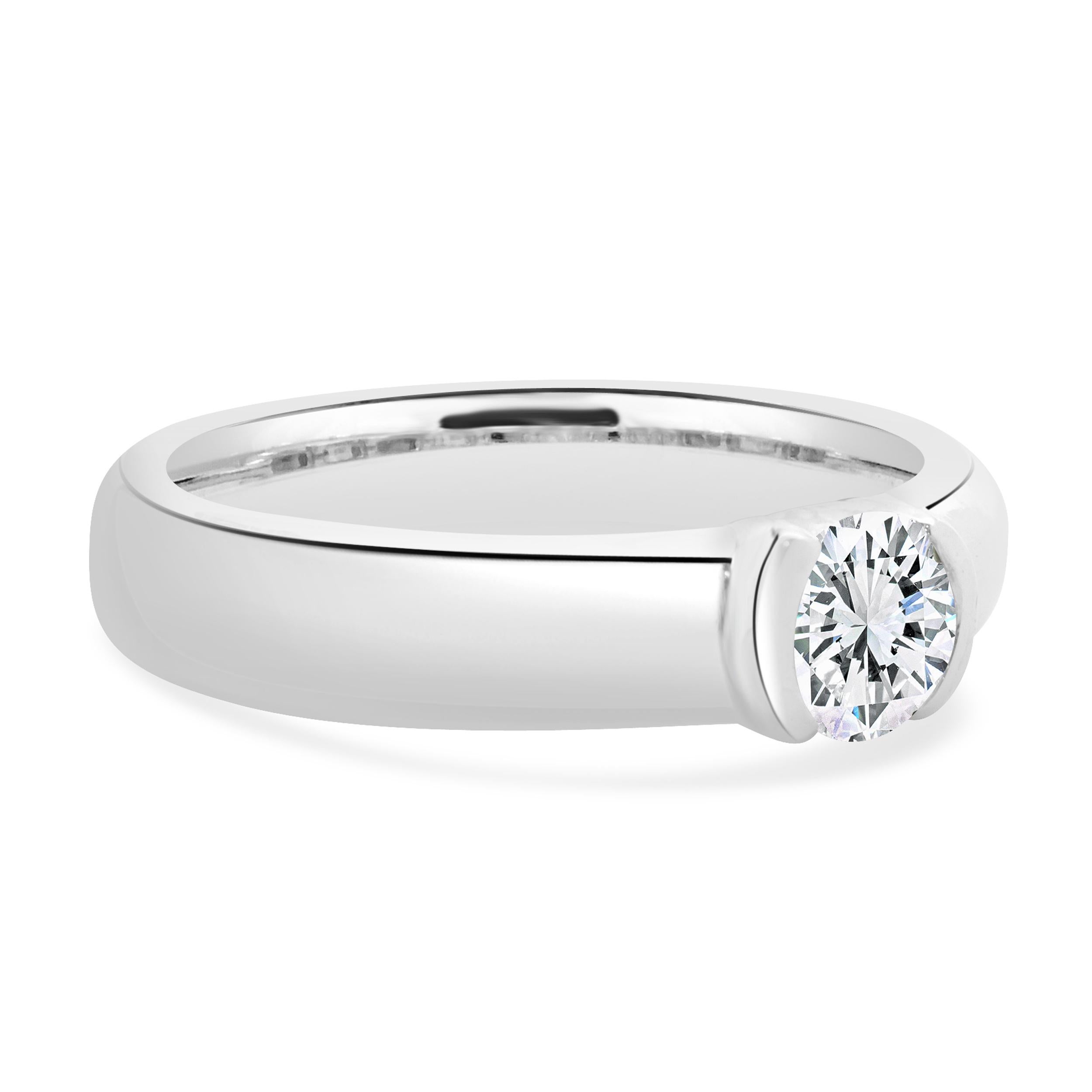 Designer: Tiffany & Co. 
Material: platinum
Diamond: 1 round brilliant cut = 0.38ct
Color: I
Clarity: VS1
Dimensions: ring top measures 4mm wide
Size: 4.5 (sizing available)
Weight: 7.53 grams

Complete with original Tiffany & Co. certificate
