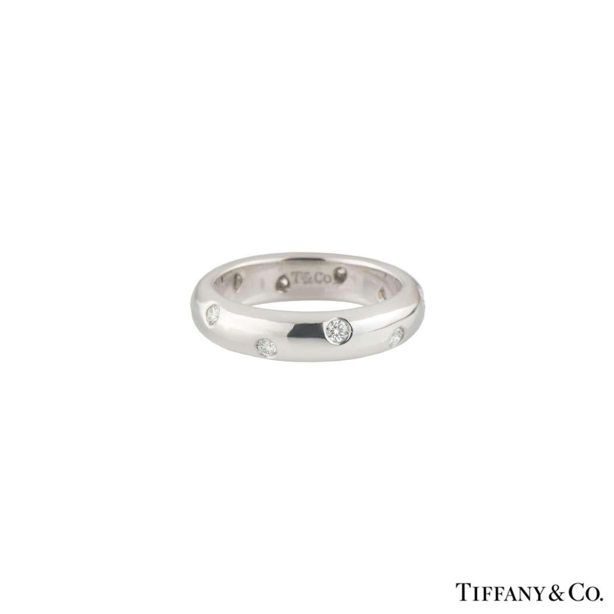 A sparkly platinum diamond Tiffany & Co. wedding band from the Etoile collection. The ring comprises of 10 round brilliant cut diamonds evenly spaced in a platinum rubover setting. The diamonds have a total weight of 0.22ct F-G colour and VVS-VS