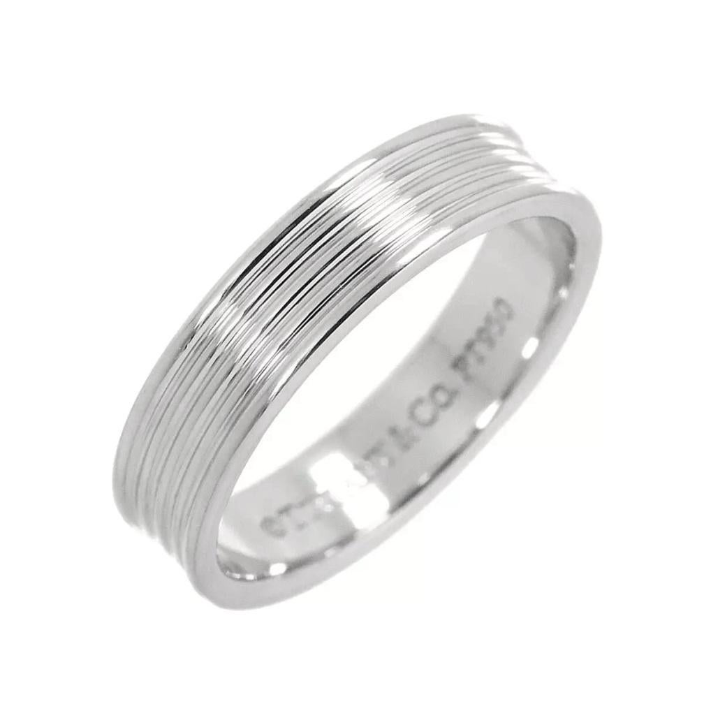 TIFFANY & Co. Platinum Five Row Wedding Band Ring 8

Metal: Platinum 
Size: 8
Band Width: 5mm 
Weight: 7.80 grams
Hallmark: ©TIFFANY&CO. PT950 
Condition: Excellent condition

Limited edition, no longer available for sale in Tiffany