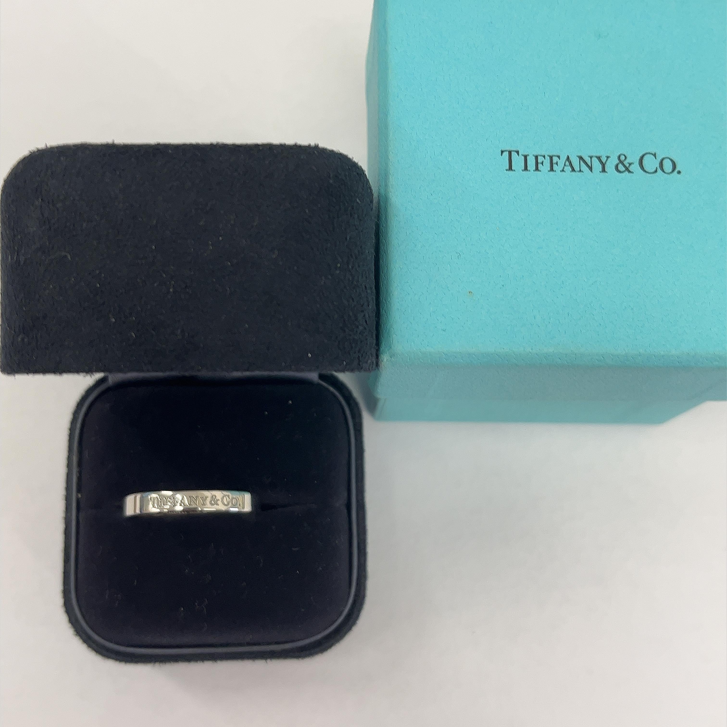Exuding timeless sophistication, the Tiffany & Co. Platinum Flat Band features a sleek design with the iconic 