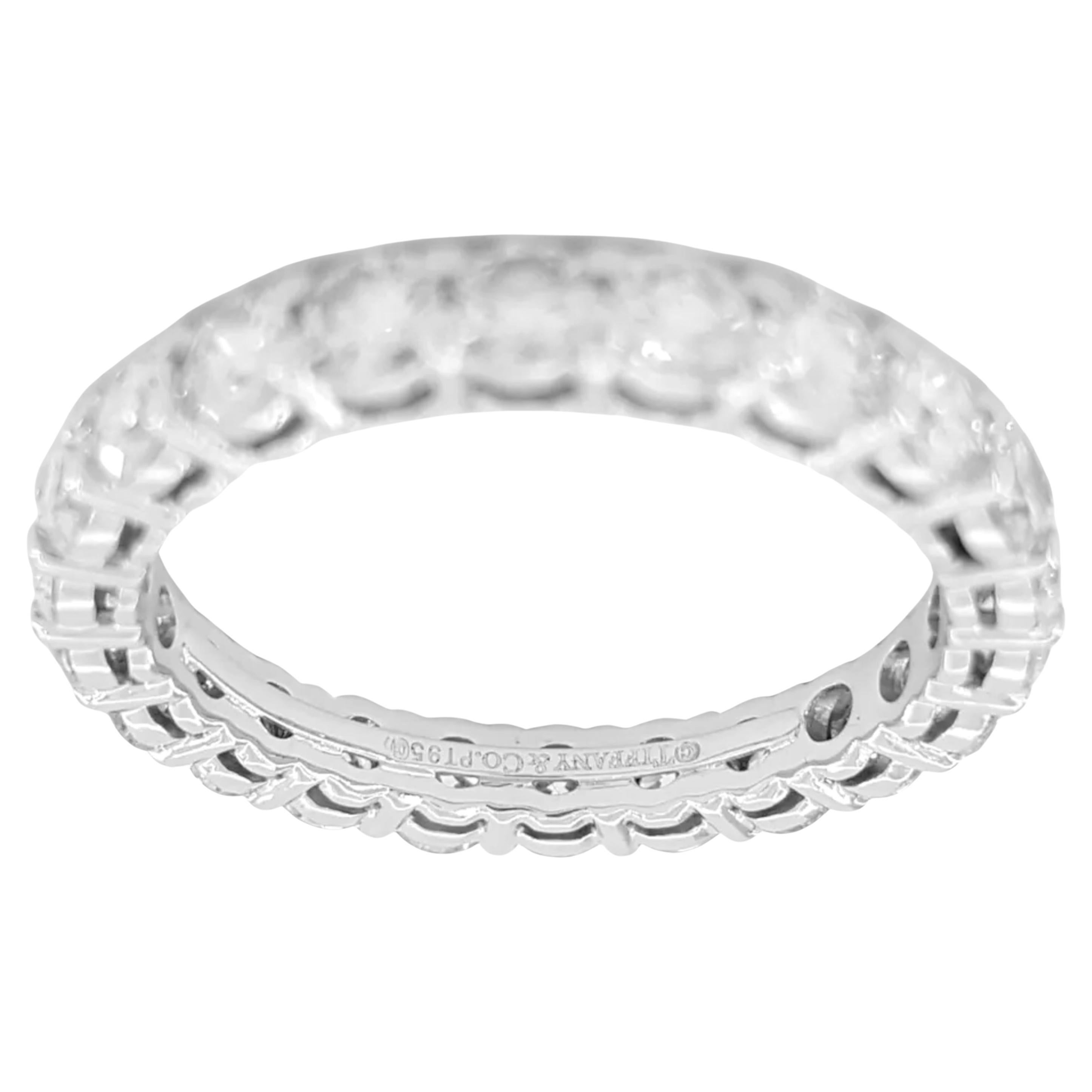 This an authentic Tiffany & Co. Forever eternity band featuring a total weight of 1.8 ct of Round Brilliant Cut diamonds set in platinum. 

Weighing 3.5 grams and sized at 6, the ring is 3mm wide and is adorned with 22 natural Round Brilliant Cut