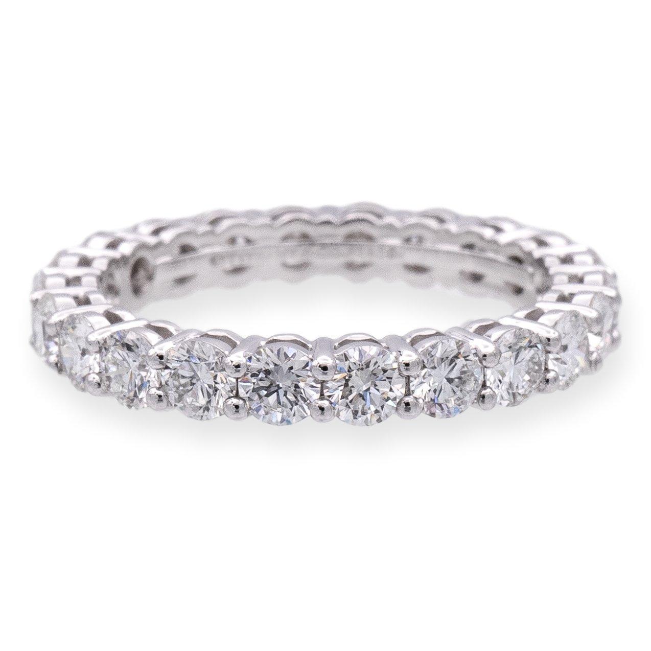 Tiffany & Co. Platinum Full Circle Diamond Ring from the iconic Forever Collection. Impeccably handcrafted in platinum boasting a full circle of scintillating round brilliant-cut diamonds, elegantly set in shared prongs, totaling a dazzling 1.80