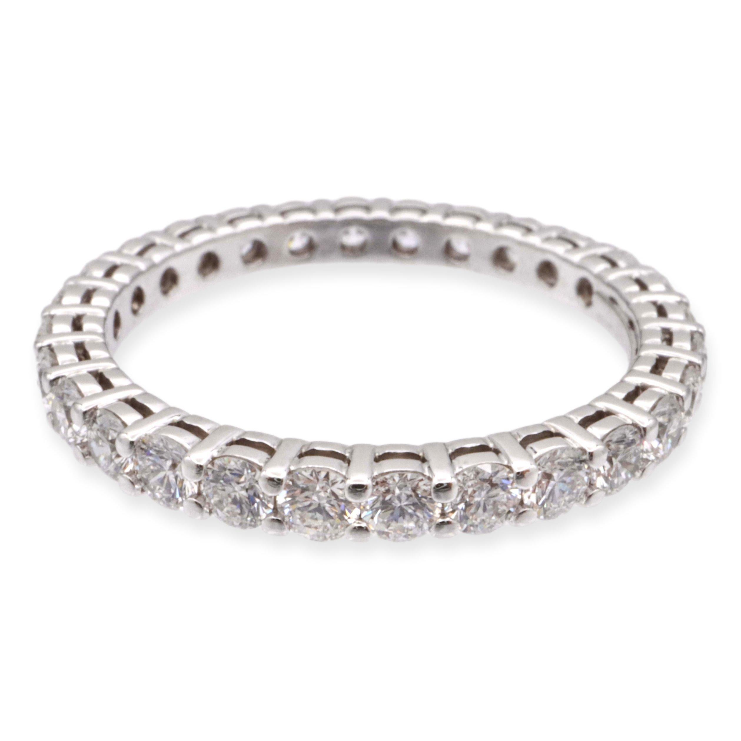 Tiffany & Co. Eternity band from the Forever collection finely crafted in Platinum with an open gallery and 28 round brilliant cut diamonds set in shared prongs weighing 0.85 carats total weight with an open gallery design. High quality diamonds