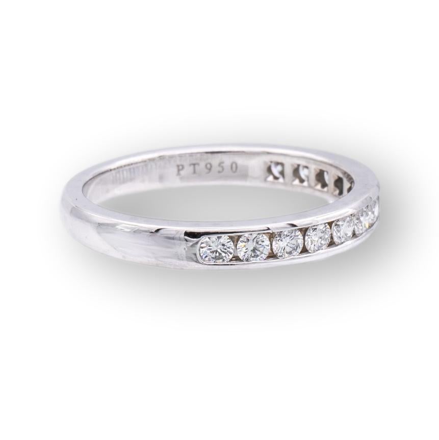 Tiffany & Co. Channel set Wedding/Anniversary band finely crafted in Platinum with 13 channel set round brilliant cut diamonds weighing 0.33 cts. total weight ranging in near colorless F-G color and VVS clarity. Fully hallmarked with logo and metal