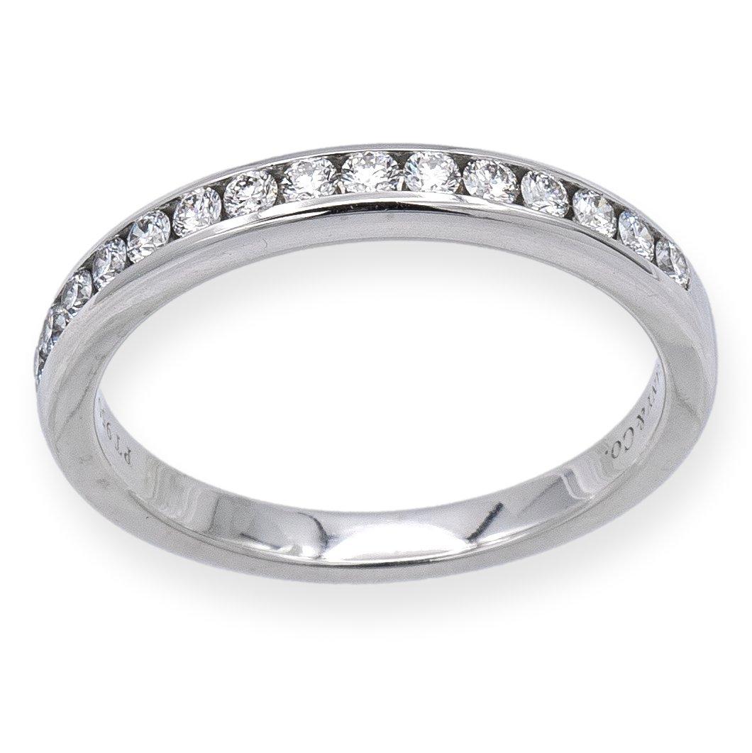 Measuring at 2.5mm wide, this exquisite ring strikes the perfect balance between simplicity and luxury. It can be worn on its own or paired with a Tiffany engagement ring for added allure. With a total carat weight of .24, this stunning wedding band
