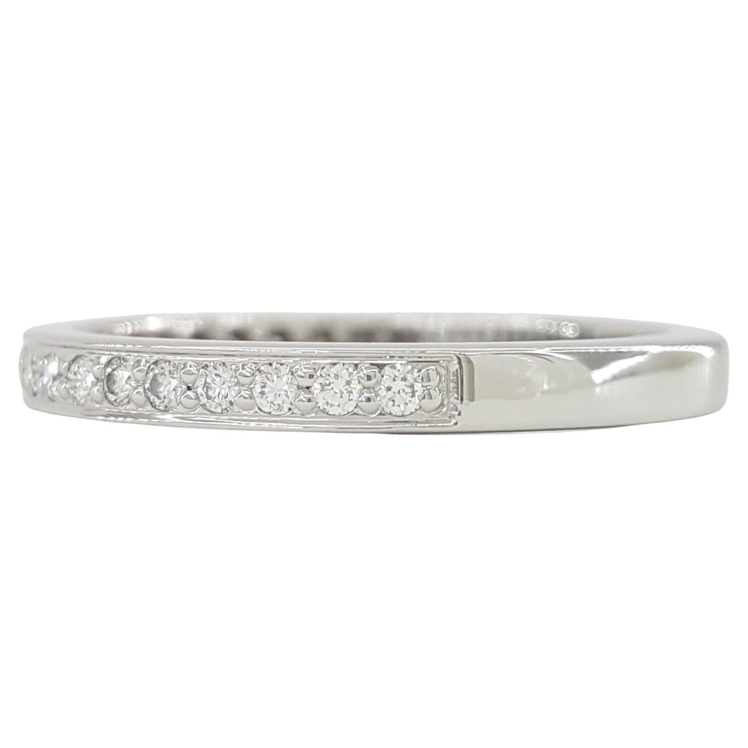 Genuine Tiffany & Co Platinum Half Circle Wedding/Anniversary Band featuring a total diamond weight of 0.22 ct. The ring, weighing 4 grams and sized 6.5, showcases 22 Natural Round Brilliant Cut Diamonds with E-G color and VVS-VS clarity.

Designed