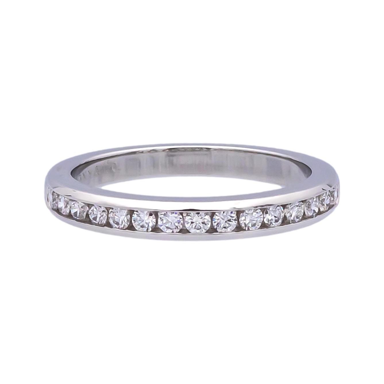 Tiffany & Co. wedding/anniversary band finely crafted in platinum with 15 channel set round brilliant cut diamonds weighing 0.24 carats total weight ranging D-G color and IF (Internally Flawless)- VS2 clarity. Accompanied by Tiffany appraisal.