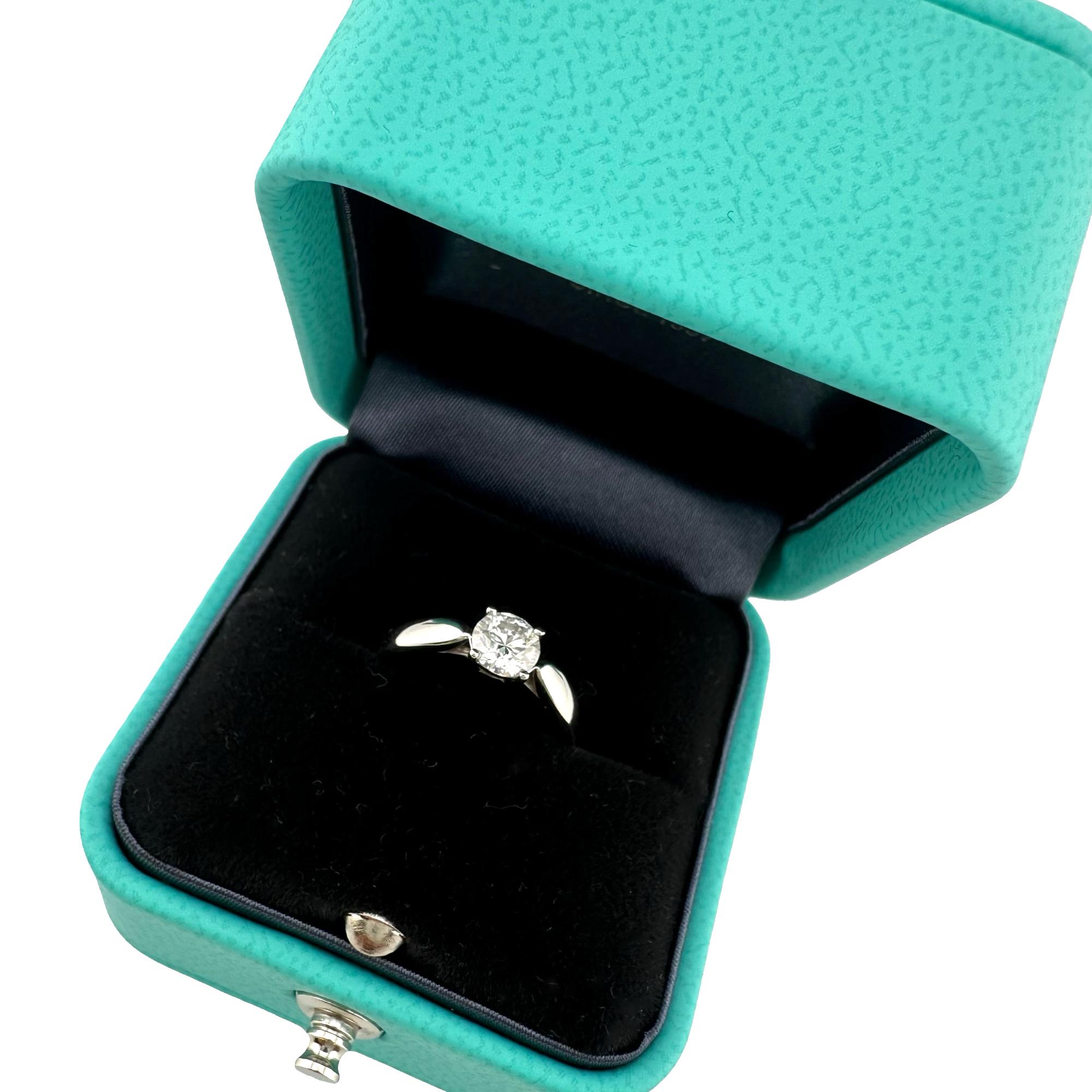 Tiffany & Co Harmony Diamond Engagement Ring
Style:  Prong Set Solitaire
Metal:  Platinum Pt950
Size:  4 sizable
Main Diamond:  Round Brilliant Diamond 0.44 cts 
Color & Clarity:  H, VS1
Hallmark:  ©TIFFANY&CO. Pt950 68966876 D0.44ct plat
Includes: 