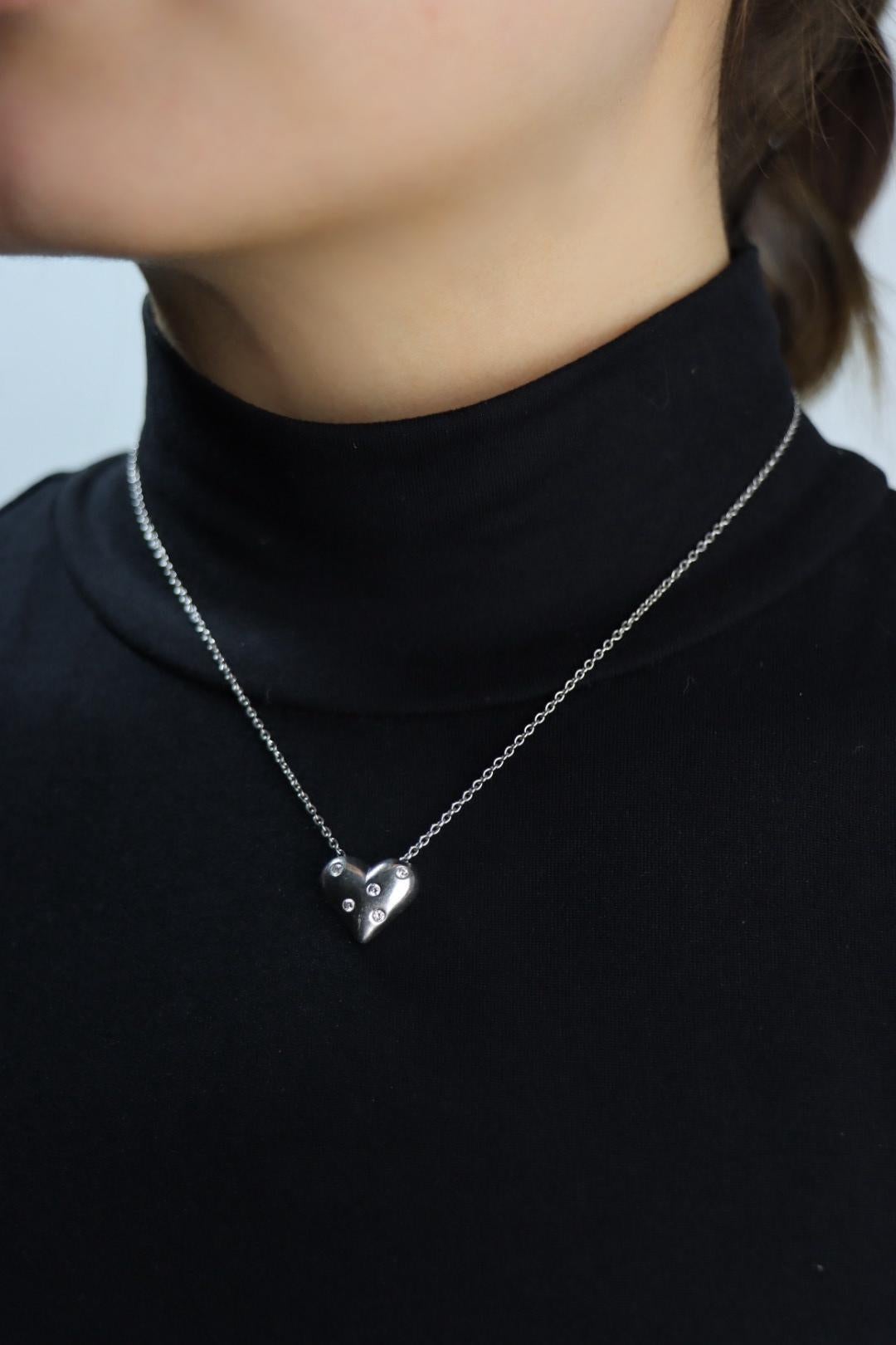 Tiffany & Co Platinum Heart Diamonds Pendant Necklace
Marked:
PT950
TIFFANY & Co.

Approximate Dimensions:
41 cm (Chain Length) 
1.5 cm (Length)
1.5 cm (Width)
12.5 grams in weight.