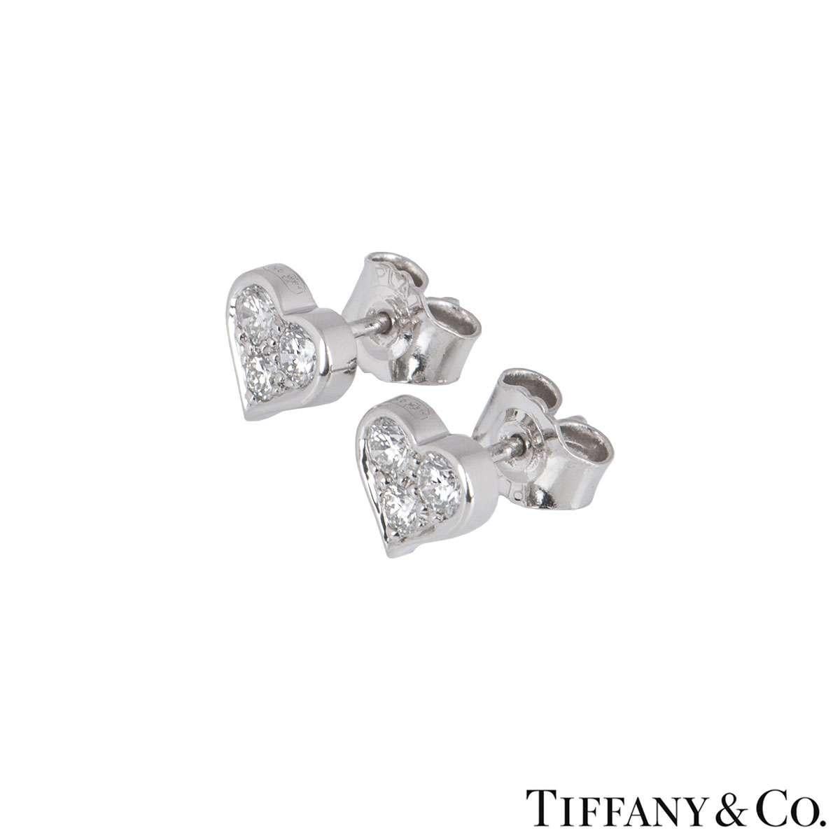 A pair of diamond earrings in platinum from the Hearts collection by Tiffany & Co. Each earring is set with three round brilliant cut diamonds totalling 0.37ct. The earrings have butterfly backs and have a gross weight of 2.92 grams.

The earrings