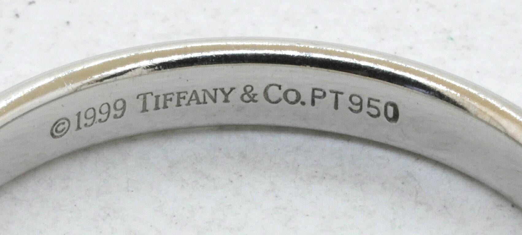 Tiffany & Co. Platinum high fashion 3mm wide band ring size 10. This fashionable piece of jewelry is crafted in gorgeous Platinum & features an elegant looking 3mm wide band ring design. Anyone will enjoy this amazing ring. Highly attractive style