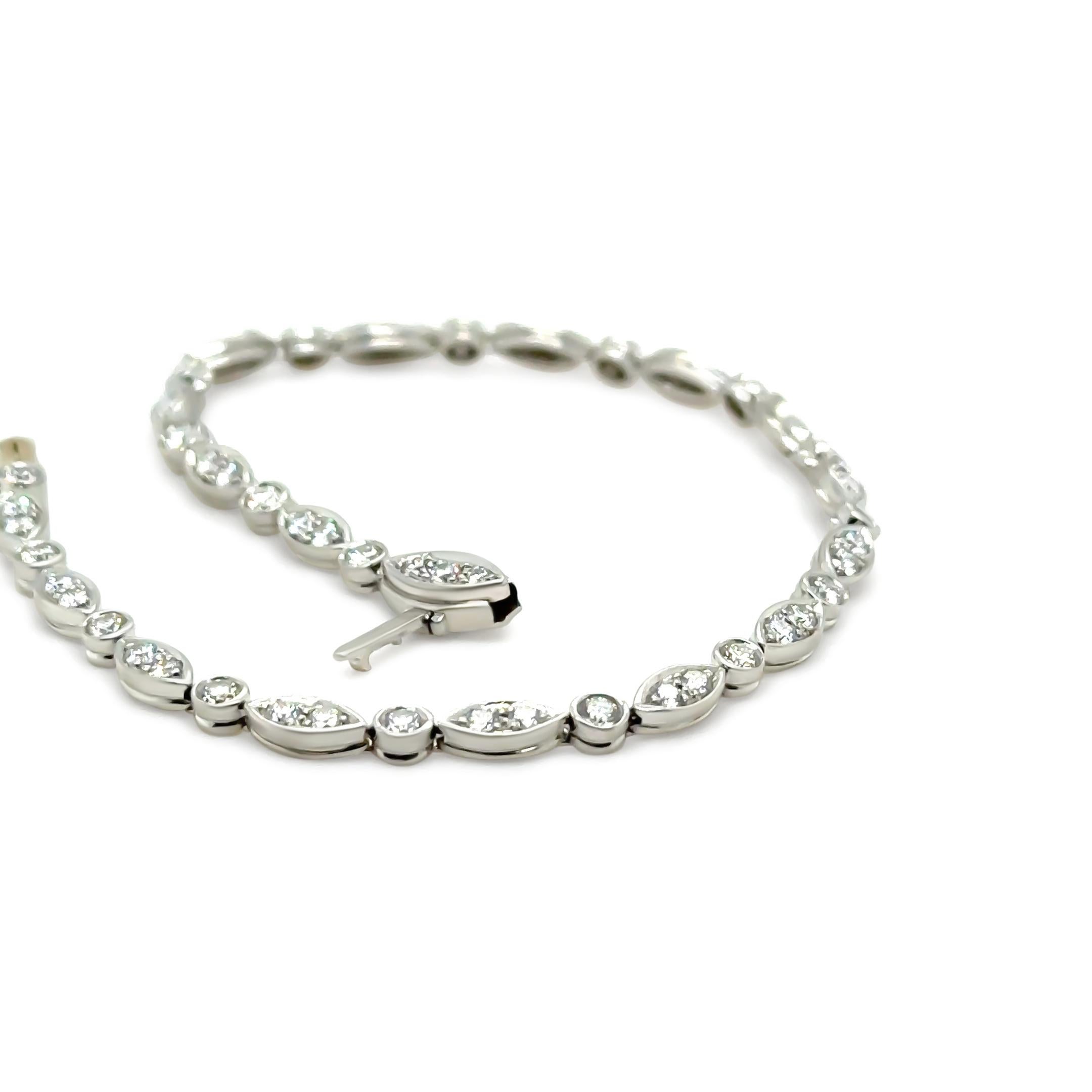This elegant Tiffany & Co. tennis bracelet from the iconic Jazz Collection is expertly crafted in platinum, featuring eighteen marquise-shaped links, each adorned with two round brilliant-cut diamonds. The bracelet showcases a total of 1.60ct in