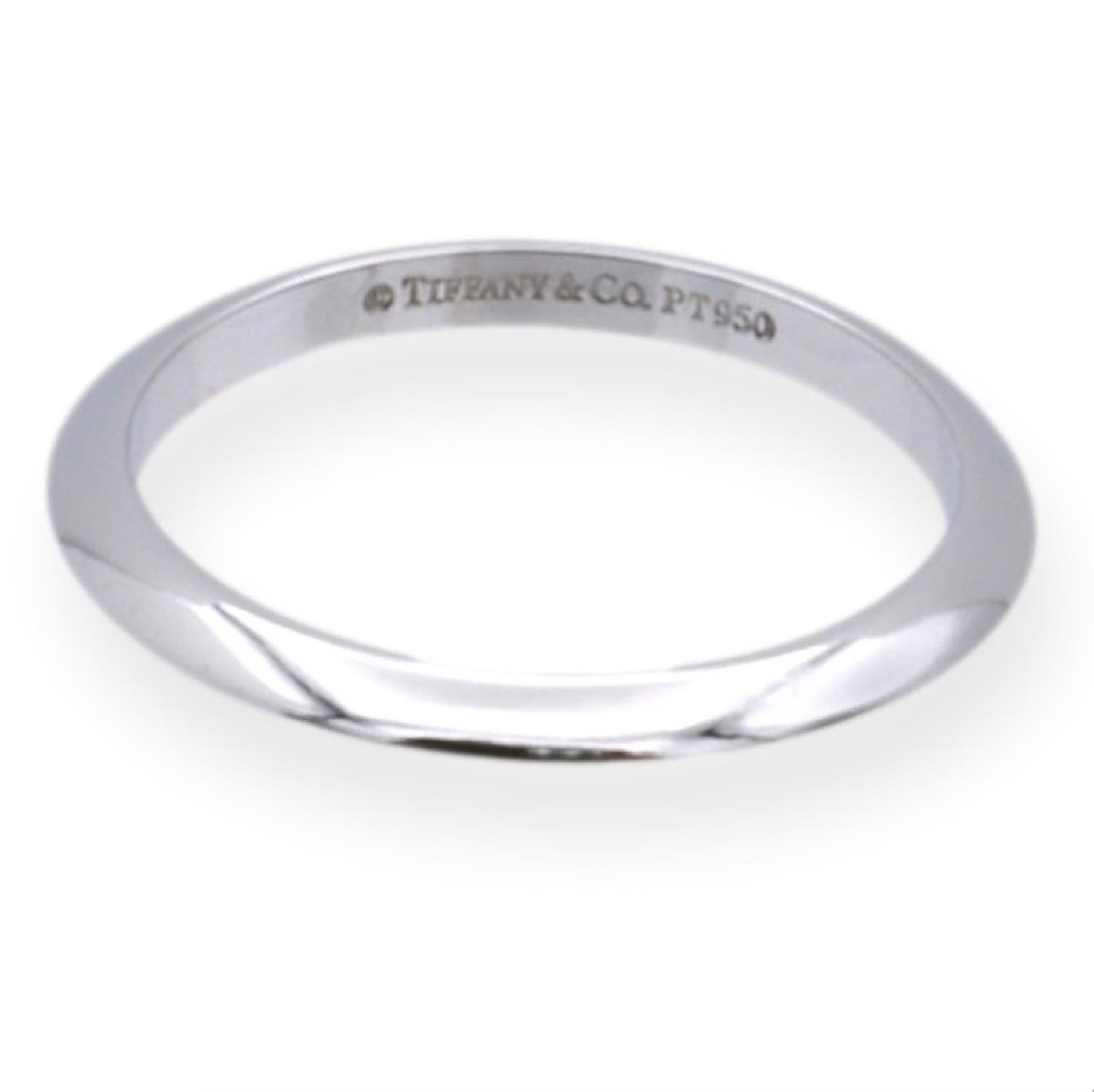 Tiffany & Co. Platinum 2mm Knife-Edge wedding band ring finely crafted in platinum.
Complements any Tiffany solitaire engagement ring. Fully hallmarked with logo and metal content. 

Ring Specifications
Brand: Tiffany & Co. 
Style: