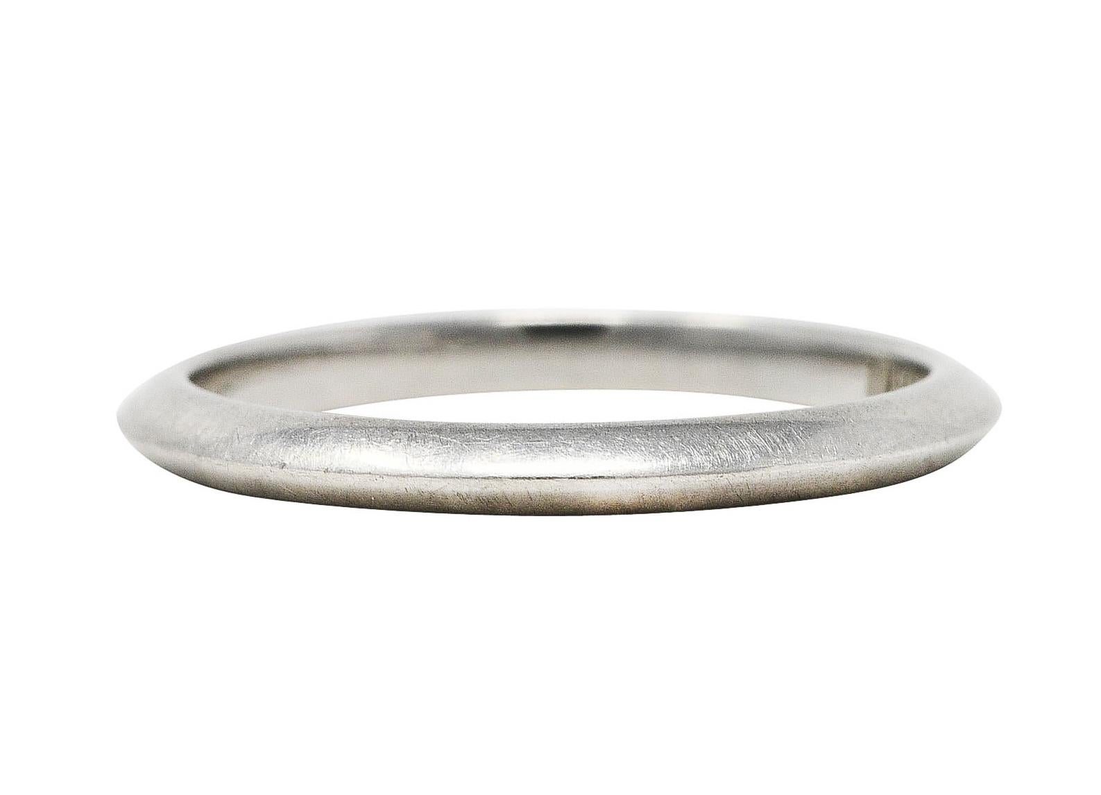 Band style ring designed with knife edge detailing

Featuring high polished finish

Stamped PT950 for platinum

Fully signed Tiffany & Co.

Circa: 2000's

Ring size: 4.5 and not sizable

Measures North to South 2.0 mm and sits 1.5 mm high

Total