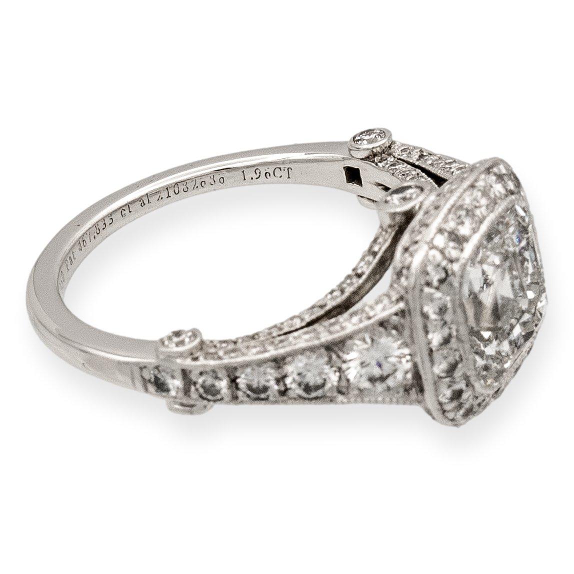 Tiffany & Co. diamond engagement ring from the Legacy collection finely crafted in platinum featuring a cushion brilliant cut center weighing 1.96 carats surrounded by 124 round brilliant cut diamonds weighing a total of 0.74 carats G-H color, fine