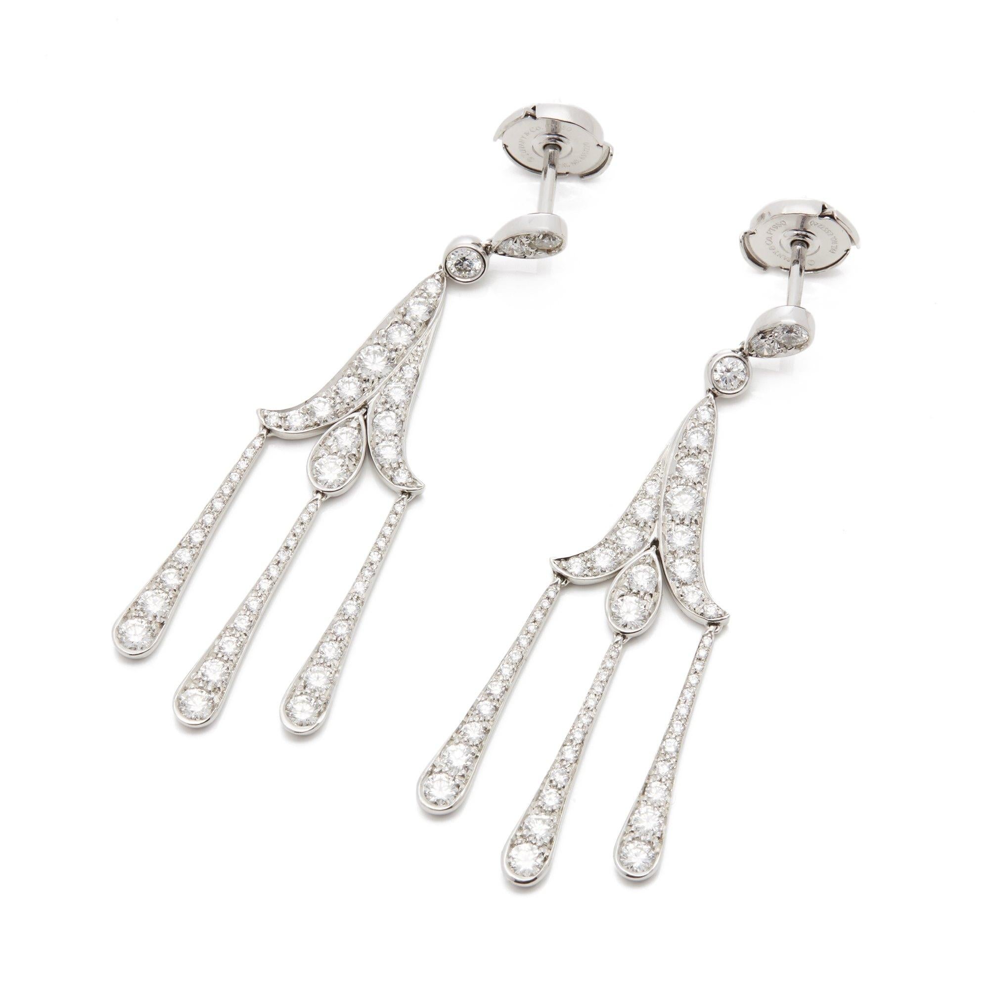 These Earrings by Tiffany are from their Legacy Collection and feature One Hundred and Eight Round Brilliant Cut Diamonds Totalling 2.32cts G Colour VS Clarity Mounted in a Platinum Articulated Drop Setting. Complete with Tiffany & Co Box and Bag. 