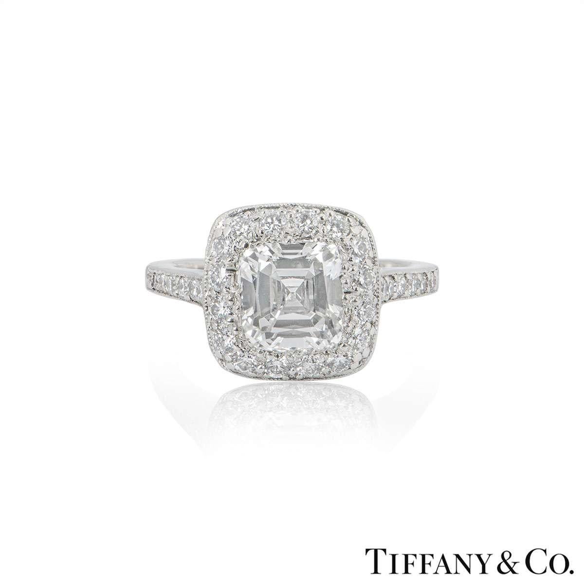 A stunning platinum diamond ring from the Legacy collection by Tiffany & Co. The ring is set to the centre with a 1.54ct modified cushion cut diamond, H colour and VS2 clarity. The diamond is complemented by diamond set shoulders and halo totalling
