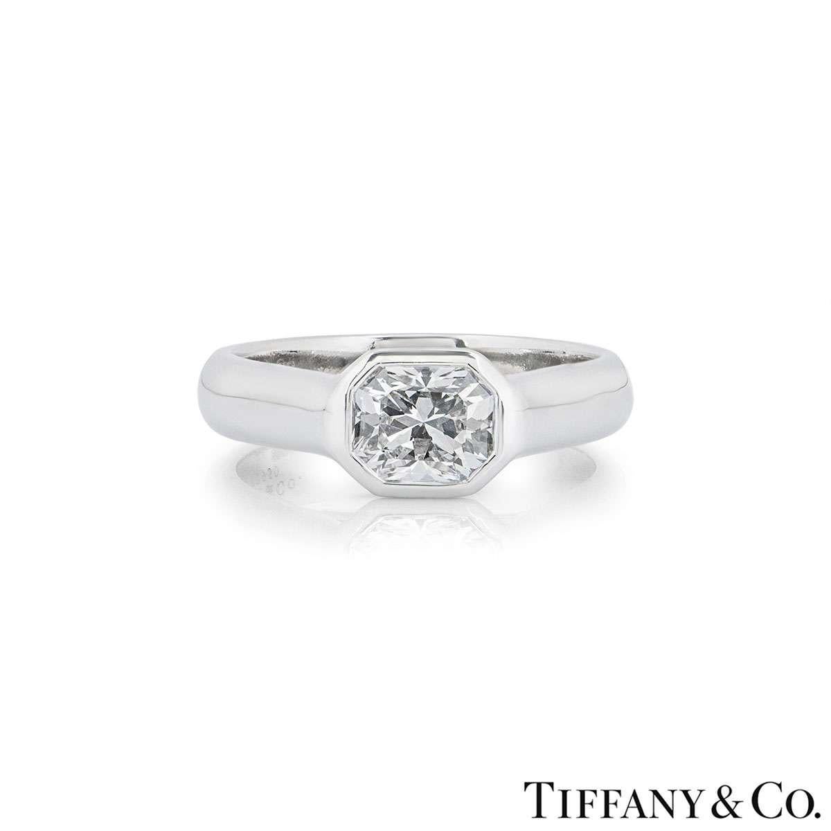 A beautiful platinum diamond ring from the Lucida collection by Tiffany & Co. The ring features a rubover set Lucida cut diamond weighing 1.03ct, F colour and IF (Internally Flawless) clarity. The ring is currently a size UK L / EU 51 / US 6 but can