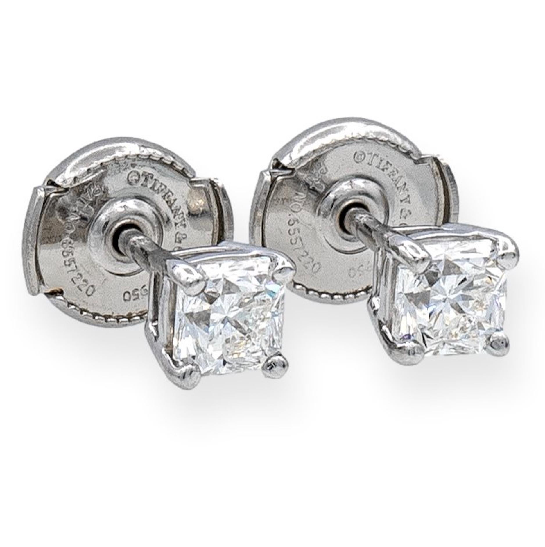 Pair of Tiffany & Co. Diamond Stud earrings from the Lucida cut collection finely crafted in a Platinum 4 prong basket setting featuring two perfectly matched cut-cornered mixed cut brilliant cut diamonds weighing 0.90 carats total weight. One