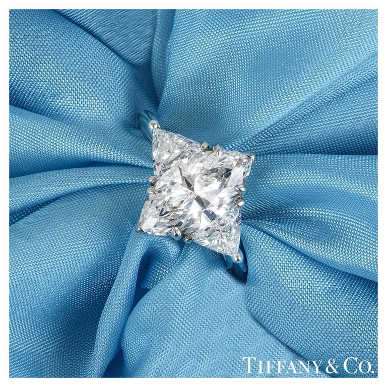 A mesmerising platinum diamond engagement ring by Tiffany & Co. The ring is set to the centre with a beautiful marquise cut diamond weighing 2.38ct, D colour and IF clarity. The centre diamond is further complemented by two trillion cut diamonds set