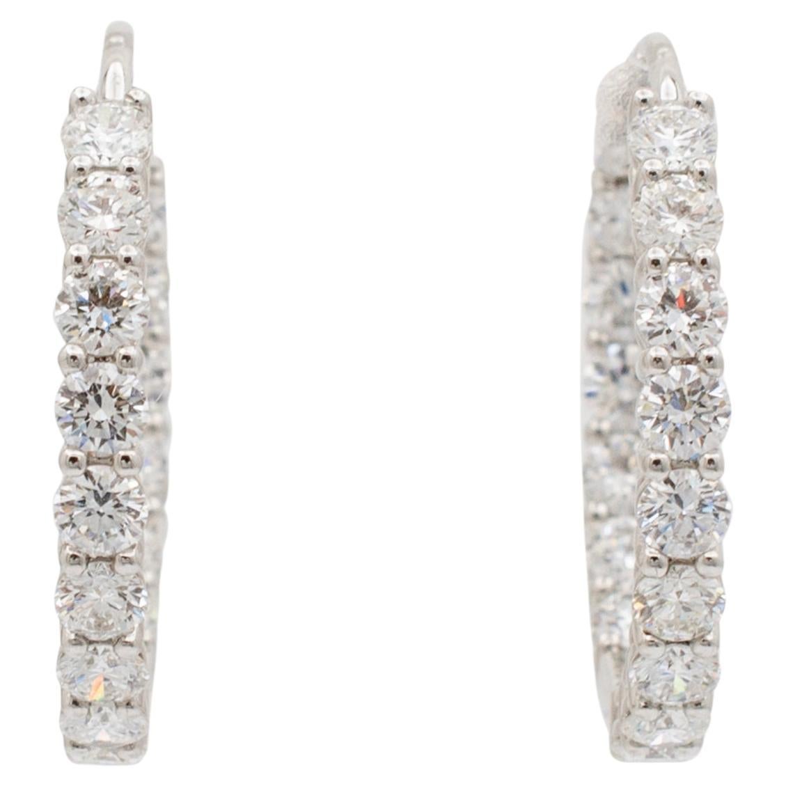 Brand: Tiffany & Co.

Gender: Ladies

Metal Type: Platinum 

Diameter: 23.75 mm 

Weight: 8.64 grams

One pair of ladies 950 platinum diamond hoop earrings with 