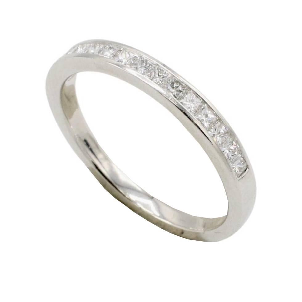 Tiffany & Co. Platinum Natural Princess Cut Diamond Half Wedding Band Ring 
Metal: Platinum
Weight: 3.41 grams
Width: 2.5mm
Size: 7 (US)
Diamonds: Approx. 0.40 CTW F-G VS princess cut natural diamonds
Signed: ©Tiffany & Co. Pt950
