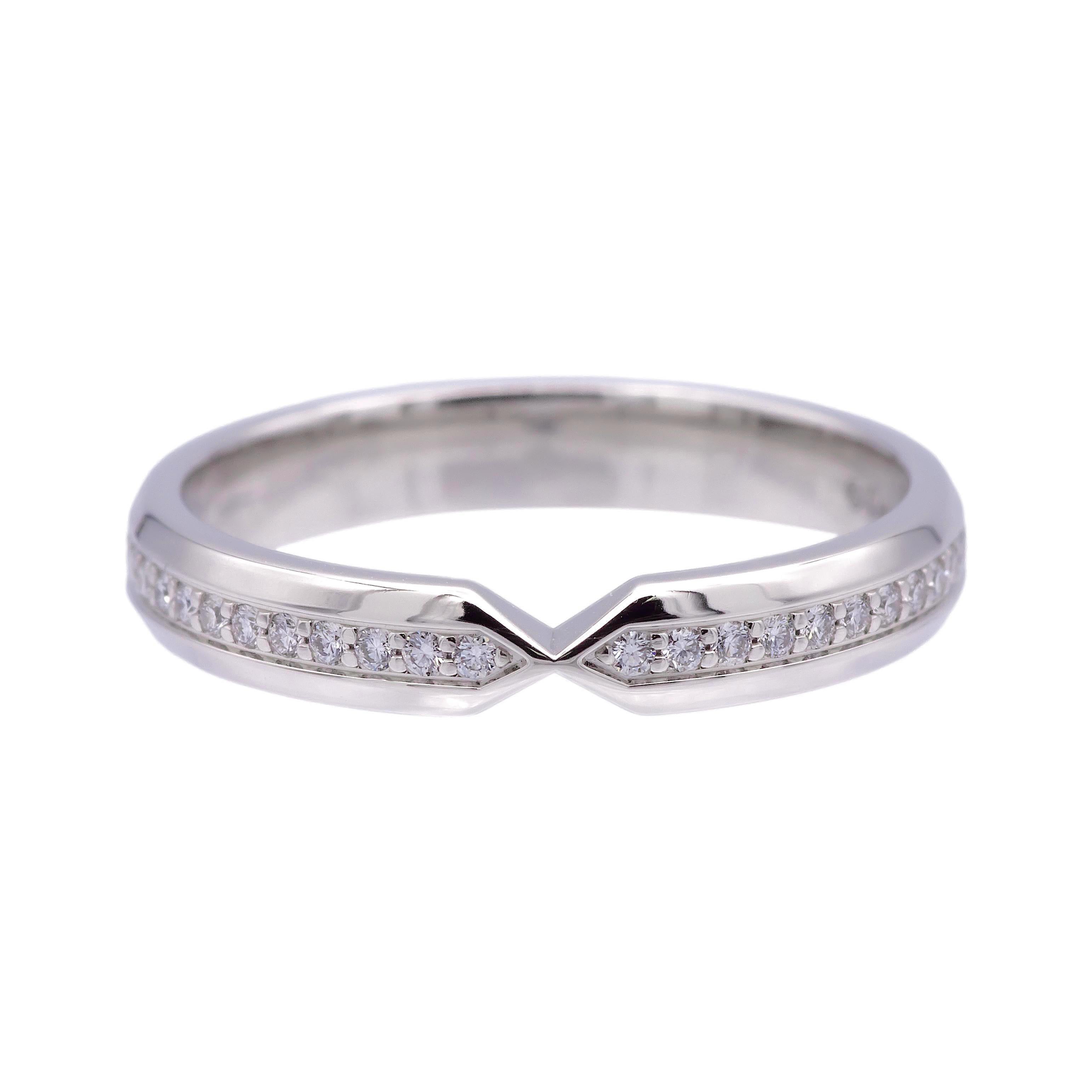 Tiffany & Co. nesting band ring from The Tiffany Setting collection finely crafted in platinum featuring a full circle of bead set round brilliant cut diamonds going all the way around weighing a total of approximately 0.14 carats meeting end to end