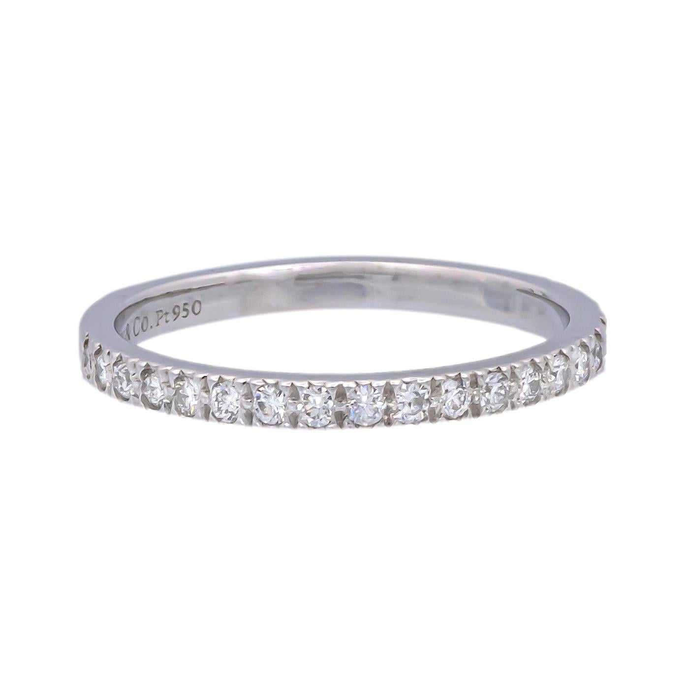 Tiffany & Co. Band ring from the Novo collection finely crafted in platinum featuring 18 round brilliant cut diamonds weighing 0.18 carats total weight approximately encrusted in bead setting going halfway around. Fully hallmarked with logo and