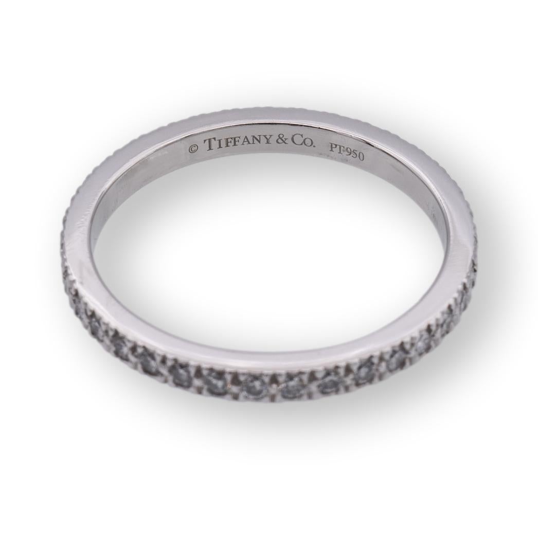 Tiffany & Co.  Band ring from the Novo collection finely crafted in platinum featuring  36 round brilliant cut diamonds weighing 0.36 carats total weight approximately encrusted in bead setting going all the way around. Fully hallmarked with logo