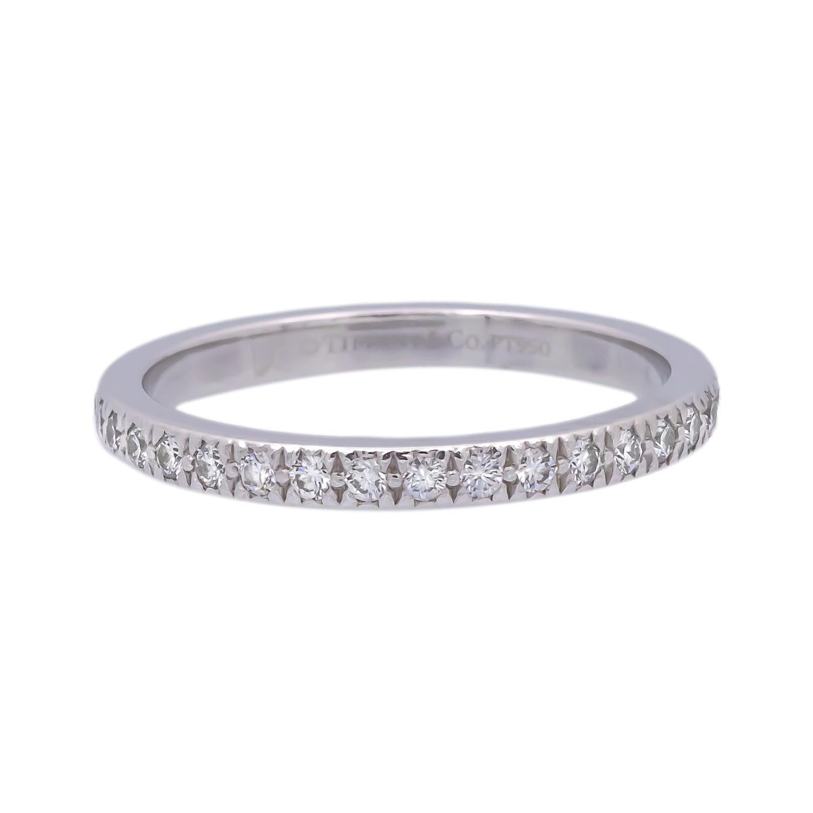 Tiffany & Co. Band ring from the Novo collection finely crafted in platinum featuring 38 round brilliant cut diamonds weighing 0.36 carats total weight approximately encrusted in bead setting going halfway around. Fully hallmarked with logo and