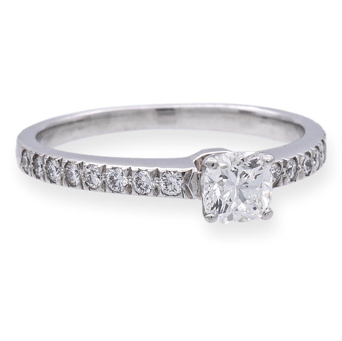 Tiffany & Co. engagement ring from the Novo collection finely crafted in platinum featuring a cushion brilliant diamond center weighing 0.35 carats , G color , VVS2 clarity set in a 4 prong basket setting adorned with 16 bead set round brilliant cut