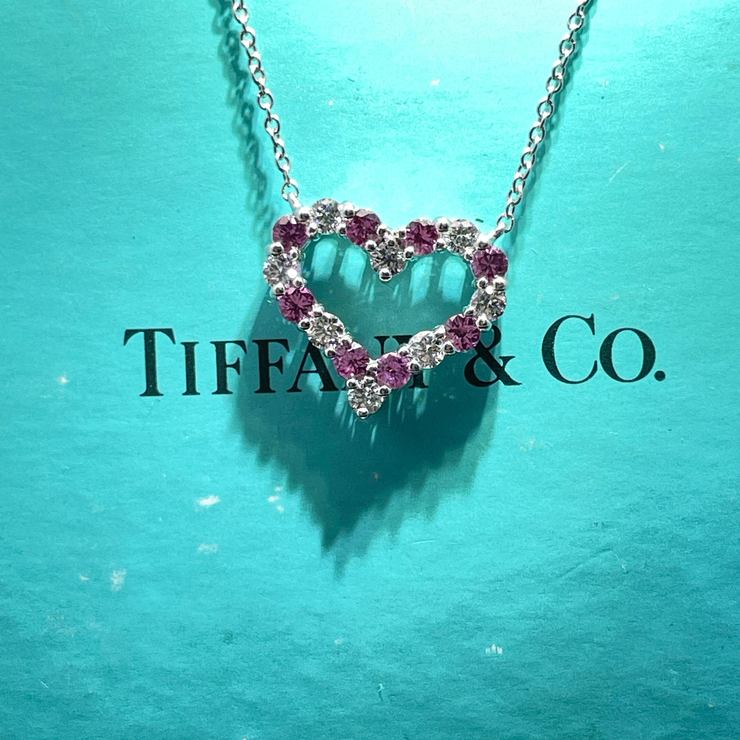 Indulge in the timeless elegance of the Tiffany & Co. Heart-Shaped Pendant Necklace, a stunning piece that beautifully combines luxury and sentiment. Crafted from high-quality platinum, this exquisite necklace features a delicate heart design
