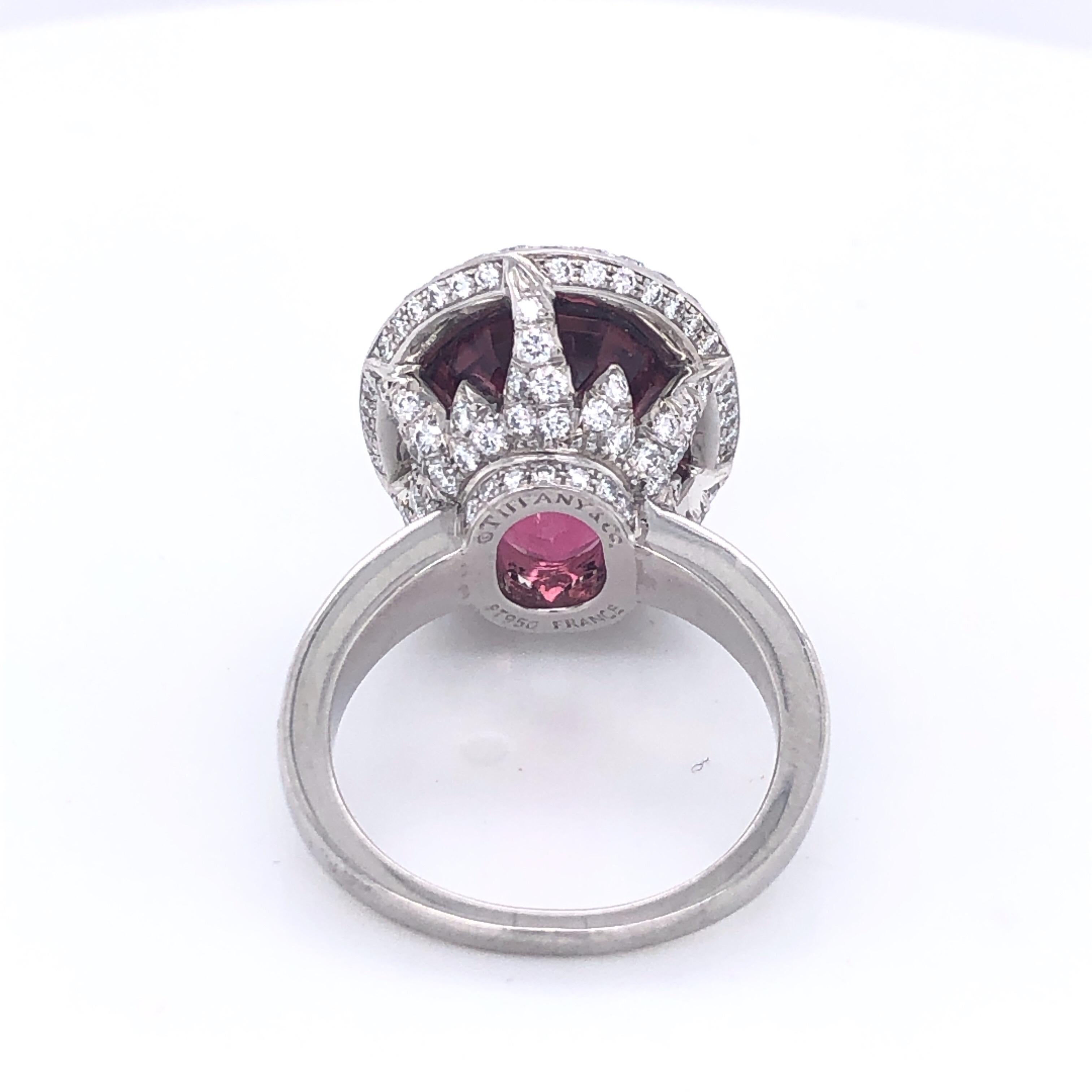 This beautiful Tiffany and Company Pink Tourmaline and Diamond Ring is sure to satisfy the pink lover!  In spectacular shape this ring sports a faceted 12 Carat Pink Tourmaline set in two carats of diamonds.  The back of the ring and it's intricate