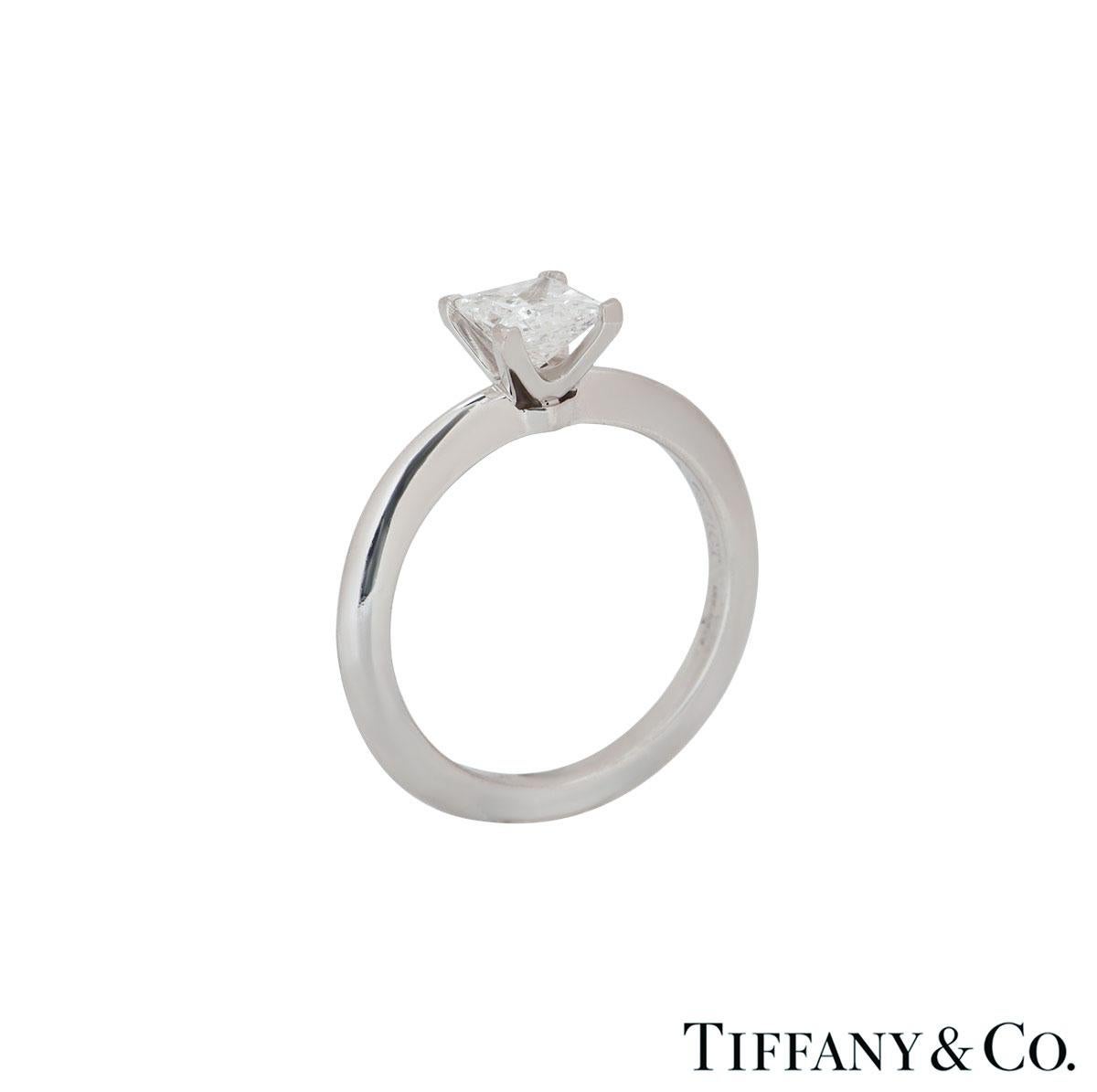 A beautiful platinum diamond ring by Tiffany & Co. The ring comprises of a princess cut diamond in a 4 claw setting with a total weight of 0.71ct, G colour and VVS1 clarity. The ring is a size UK K½, EU 50.5 and US 5½ but can be adjusted for a