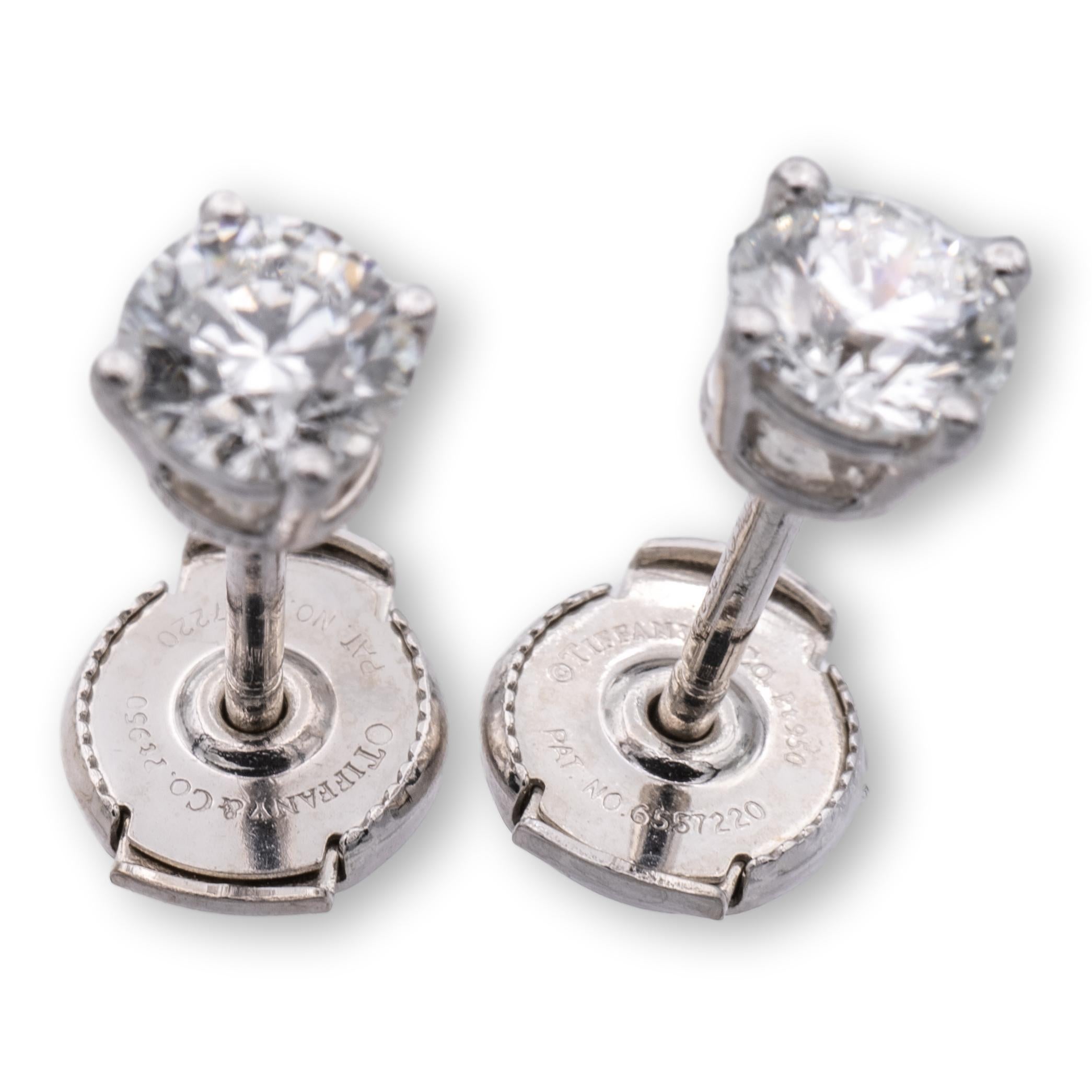 solitaire diamond stud earrings