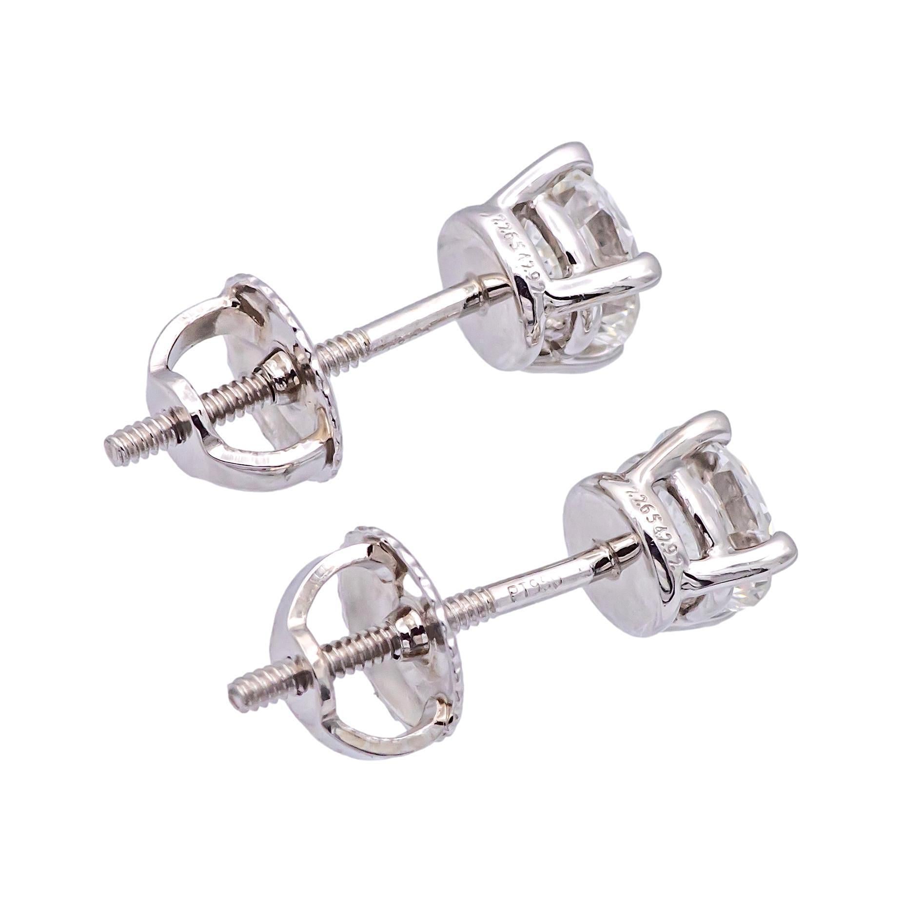 Brilliant Cut Tiffany & Co. Platinum Round 0.95Cts. TW VVS1 Diamond Solitaire Stud Earrings For Sale
